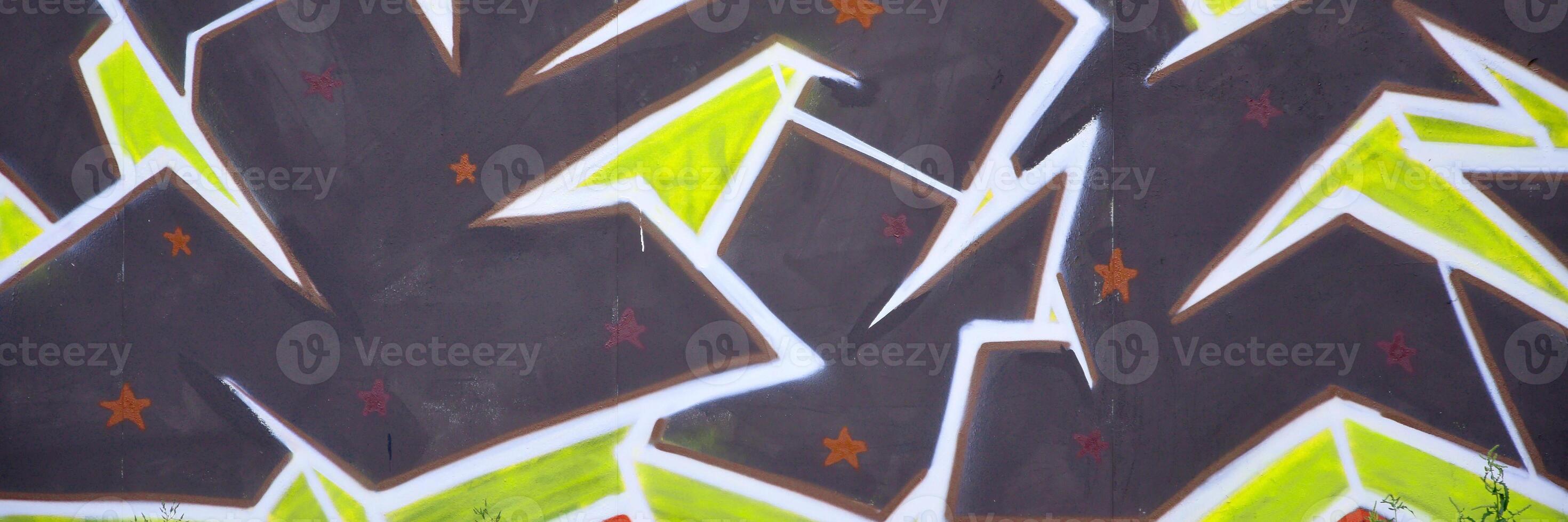 Colorful background of graffiti painting artwork with bright aerosol outlines on wall. Old school street art piece made with aerosol spray paint cans. Contemporary youth culture photo