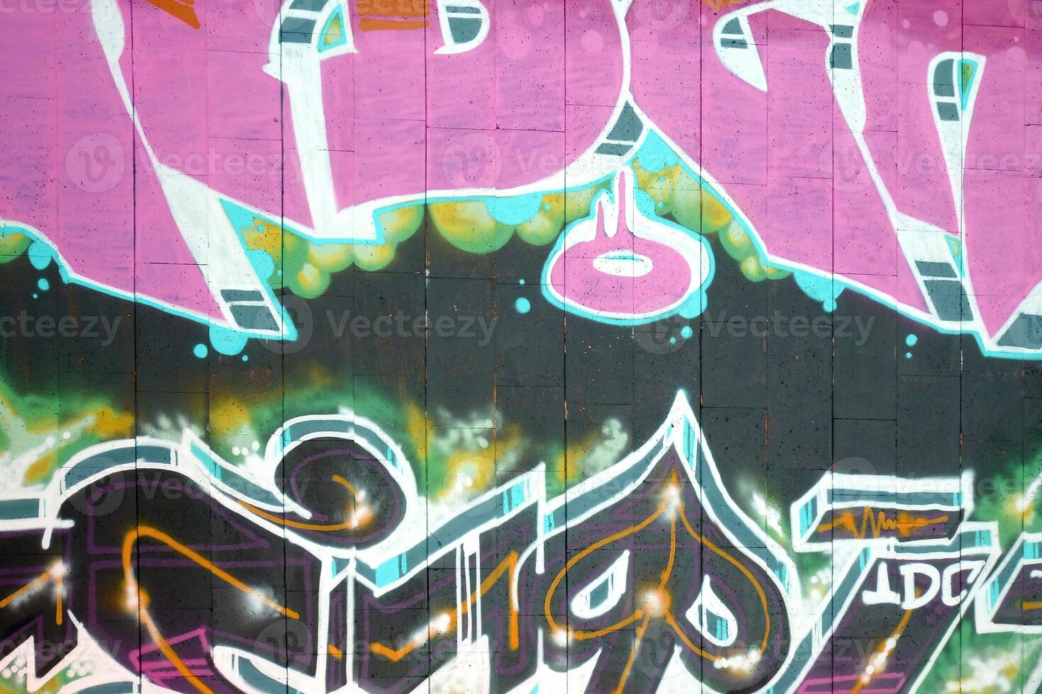 Colorful background of graffiti painting artwork with bright aerosol outlines on wall. Old school street art piece made with aerosol spray paint cans. Contemporary youth culture photo