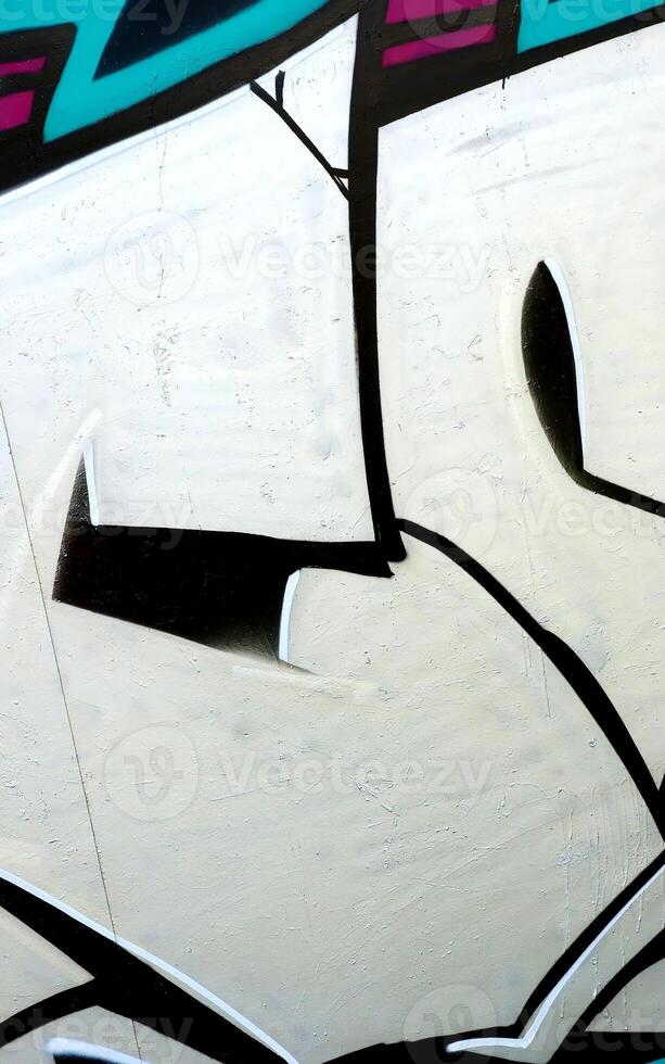 Colorful background of graffiti painting artwork with bright aerosol outlines on wall. Old school street art piece made with aerosol spray paint cans. Contemporary youth culture photo