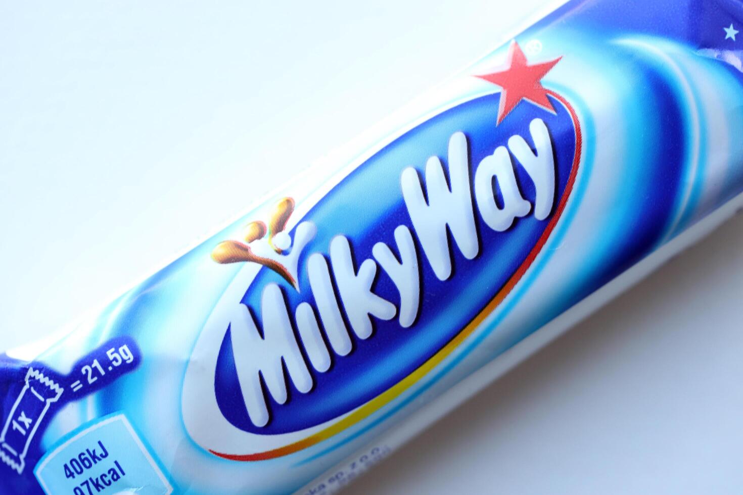 KYIV, UKRAINE - APRIL 20, 2024 Milky Way or MilkyWay small chocolate bar. Milky Way bars is worldwide famous product photo