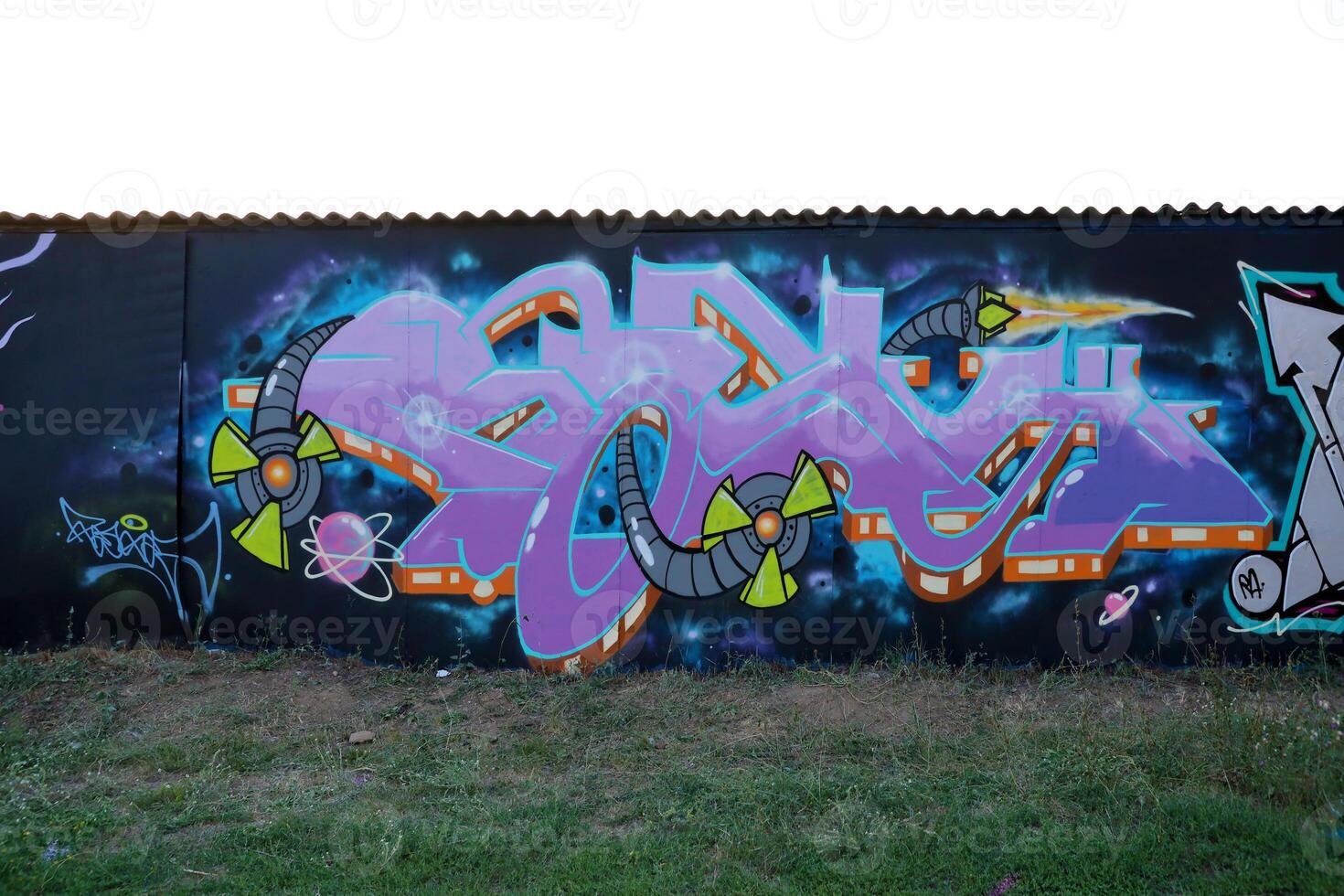 Colorful background of graffiti painting artwork with bright aerosol outlines on wall. Old school street art piece made with aerosol spray paint cans. Contemporary youth culture photo