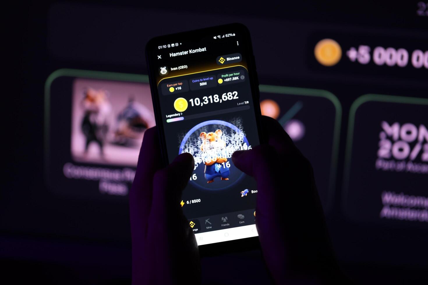 KYIV, UKRAINE - APRIL 20, 2024 Hamster Kombat telegram bot on smartphone screen. Hamster Kombat is a viral Telegram-based crypto game for earn HMSTR tokens by managing virtual crypto exchange photo