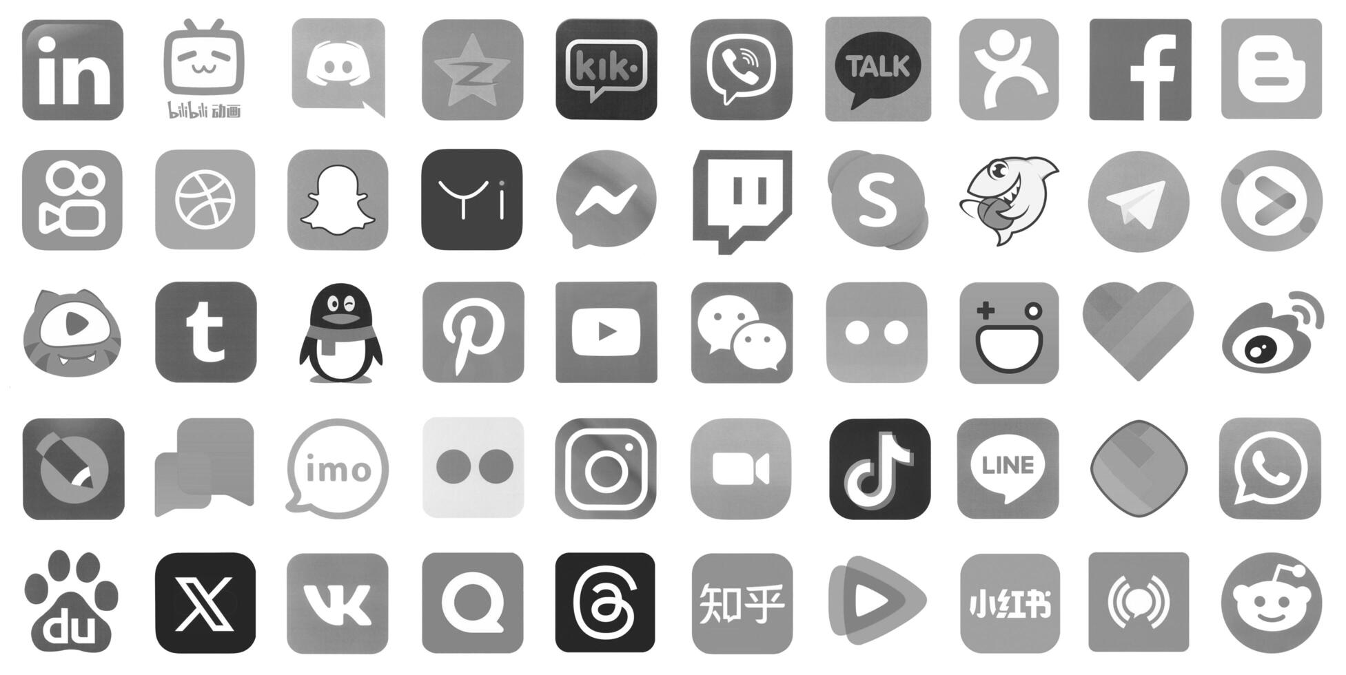 KYIV, UKRAINE - APRIL 1, 2024 Many icons of social media, messengers, sharing platforms photo