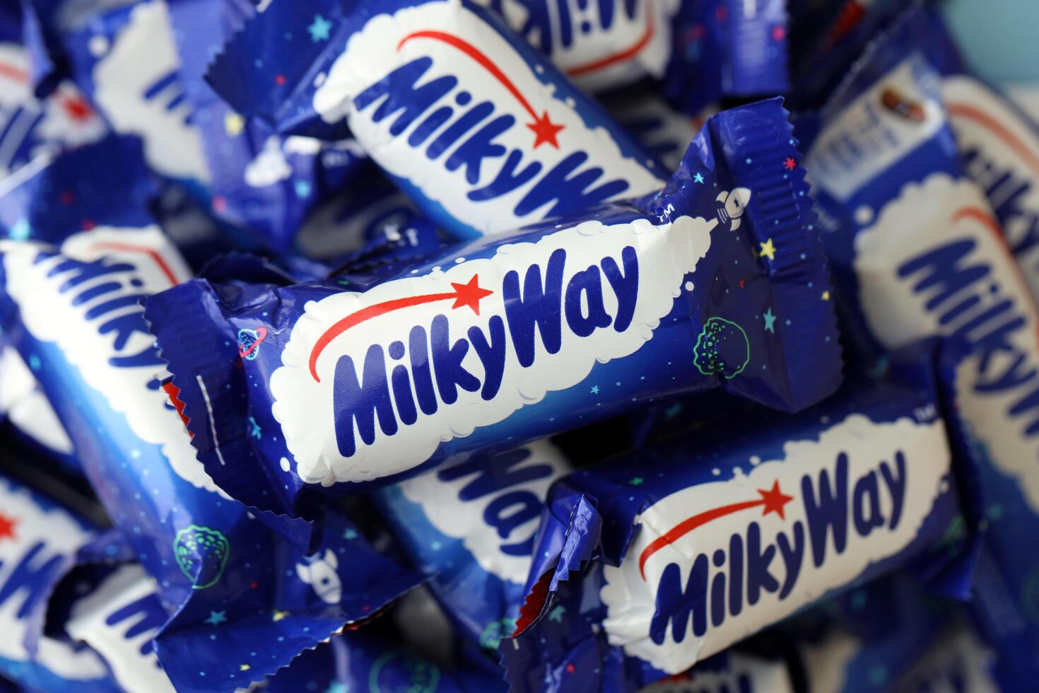 KYIV, UKRAINE - APRIL 20, 2024 Milky Way or MilkyWay small chocolate bars. Milky Way bars is worldwide famous product photo
