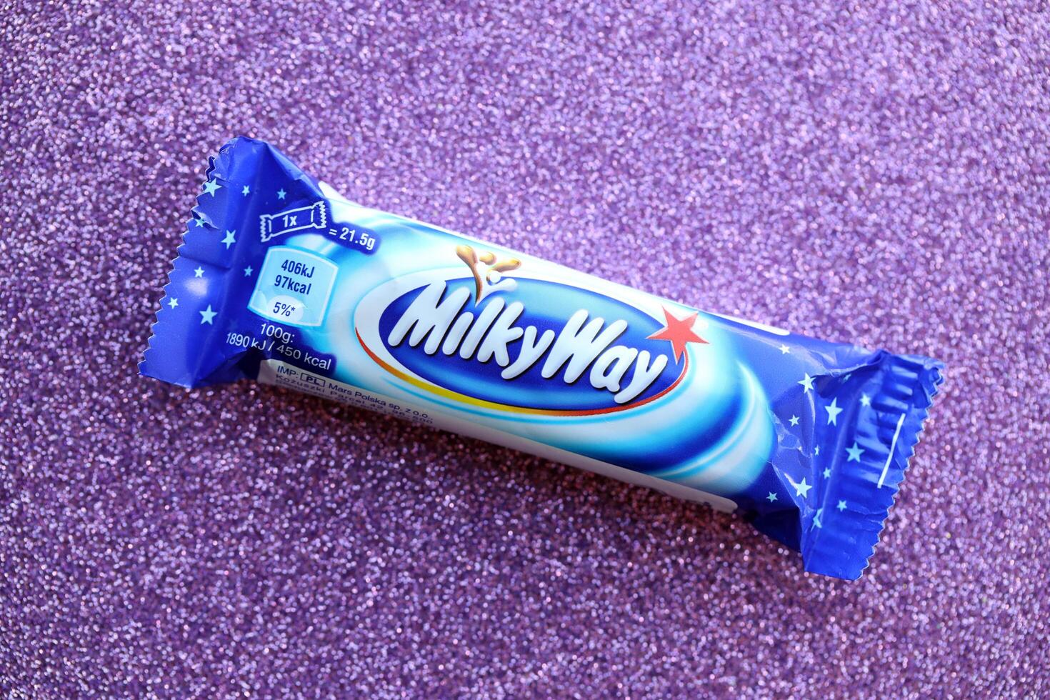 KYIV, UKRAINE - APRIL 20, 2024 Milky Way or MilkyWay small chocolate bar. Milky Way bars is worldwide famous product photo