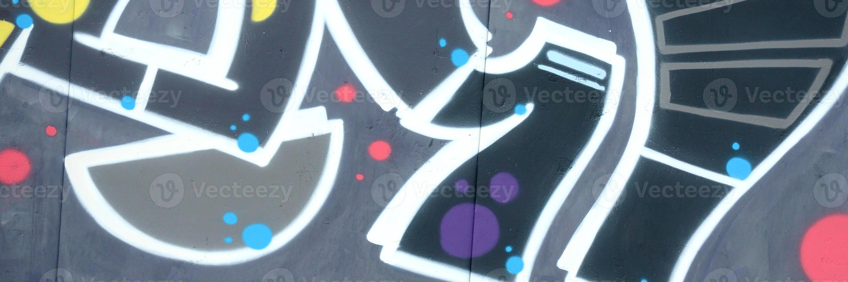 Colorful background of graffiti painting artwork with bright aerosol outlines on wall. Old school street art piece made with aerosol spray paint cans. Contemporary youth culture photo