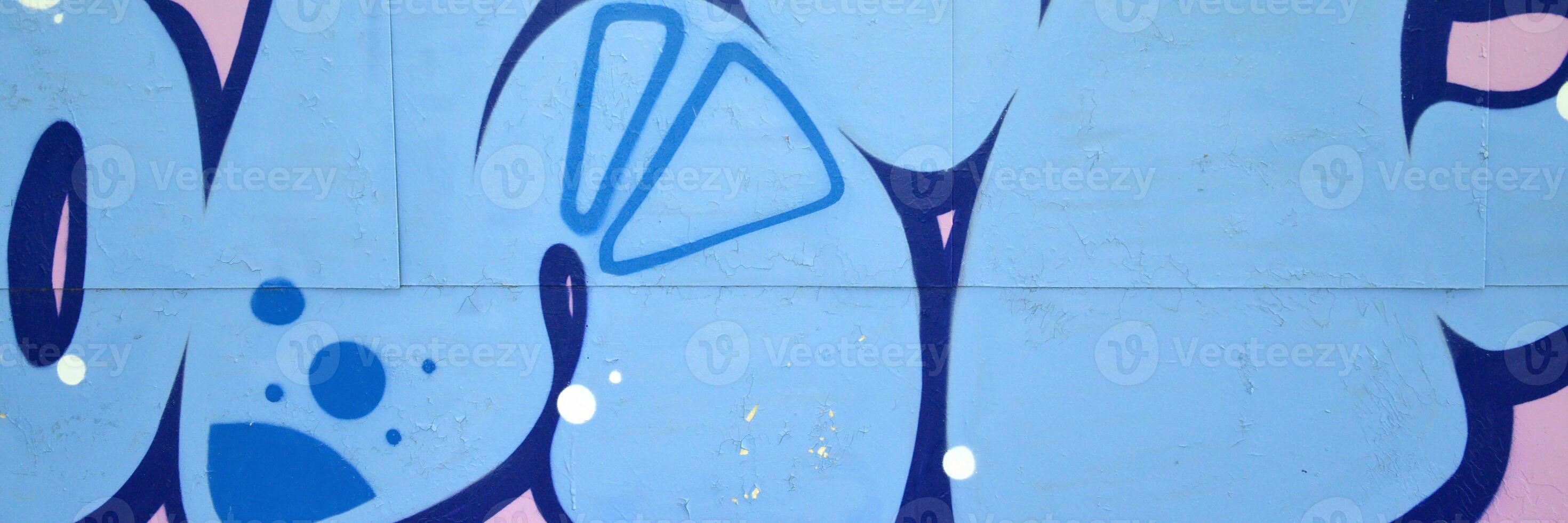 Colorful background of graffiti painting artwork with bright aerosol outlines on wall. Old school street art piece made with aerosol spray paint cans. Contemporary youth culture photo