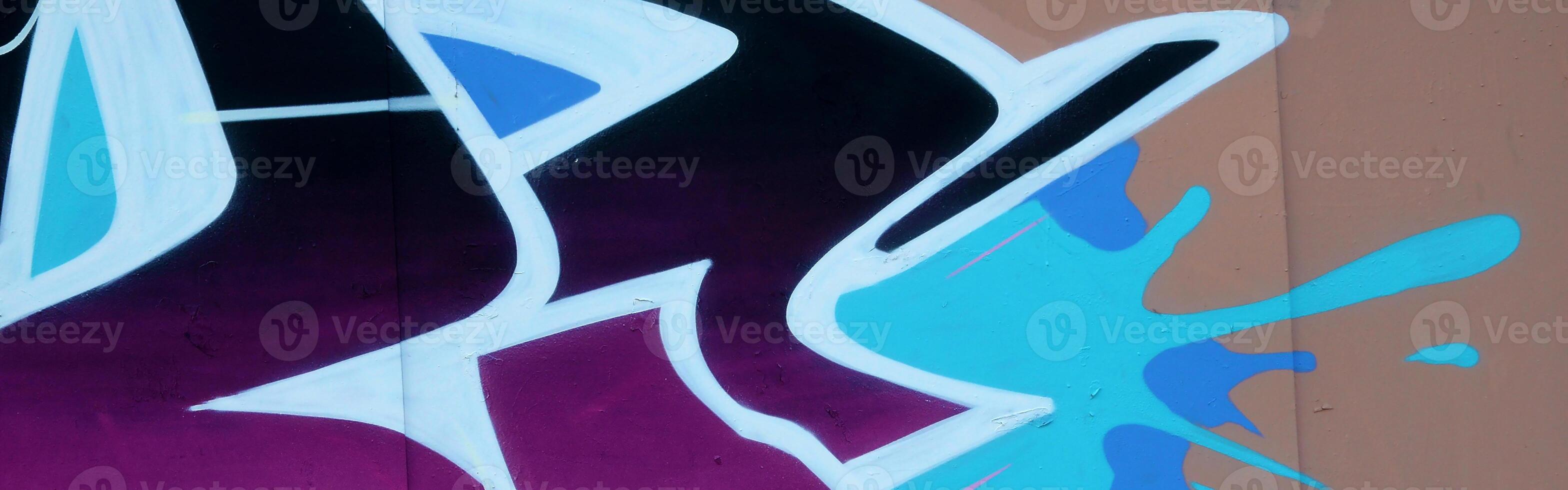 Colorful background of graffiti painting artwork with bright aerosol outlines on wall. Old school street art piece made with aerosol spray paint cans. Contemporary youth culture photo