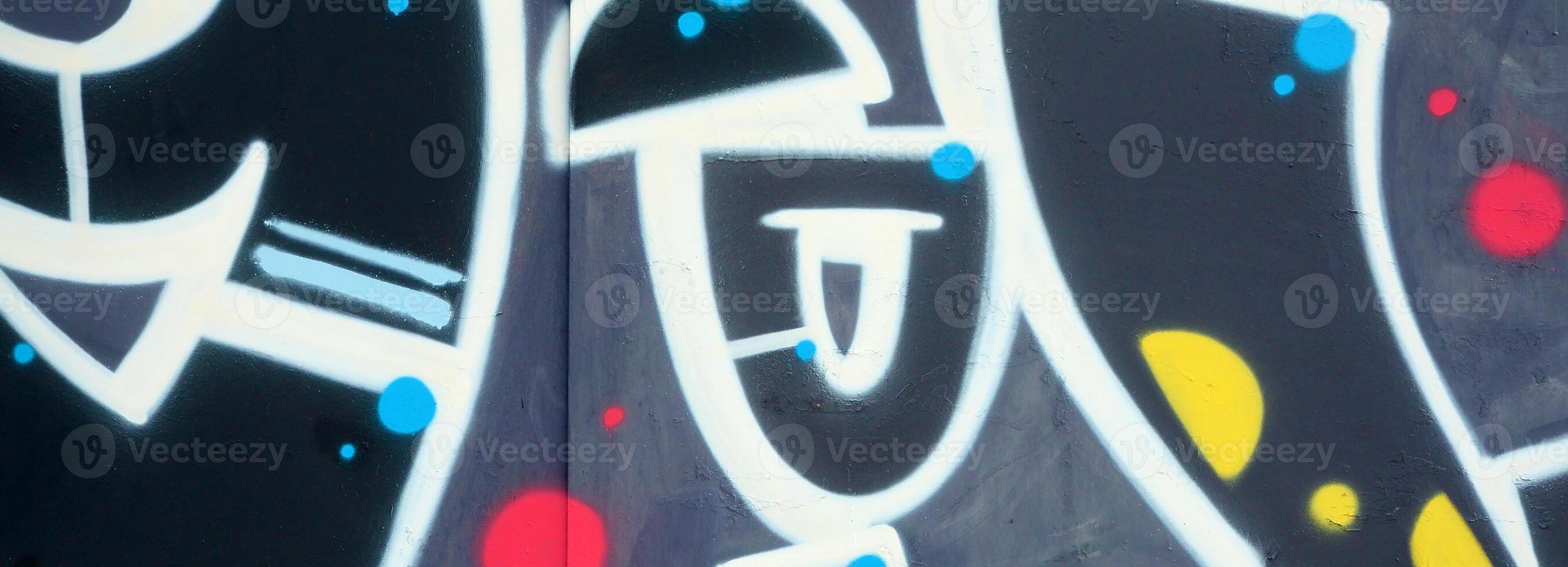 Colorful background of graffiti painting artwork with bright aerosol outlines on wall. Old school street art piece made with aerosol spray paint cans. Contemporary youth culture photo