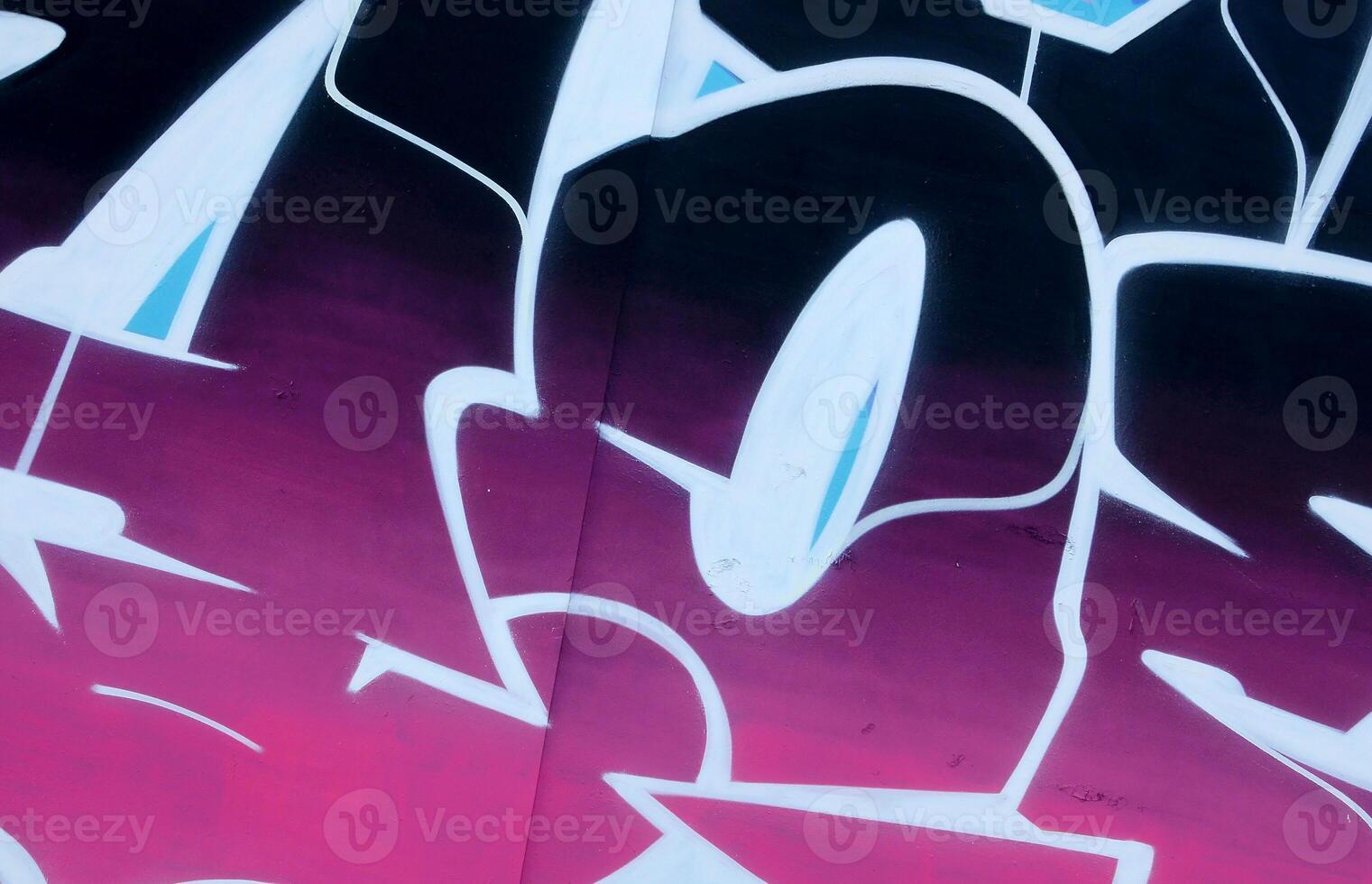 Colorful background of graffiti painting artwork with bright aerosol outlines on wall. Old school street art piece made with aerosol spray paint cans. Contemporary youth culture photo