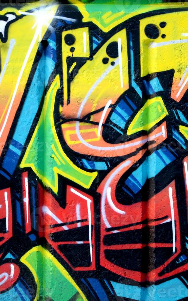 Colorful background of graffiti painting artwork with bright aerosol outlines on wall. Old school street art piece made with aerosol spray paint cans. Contemporary youth culture photo
