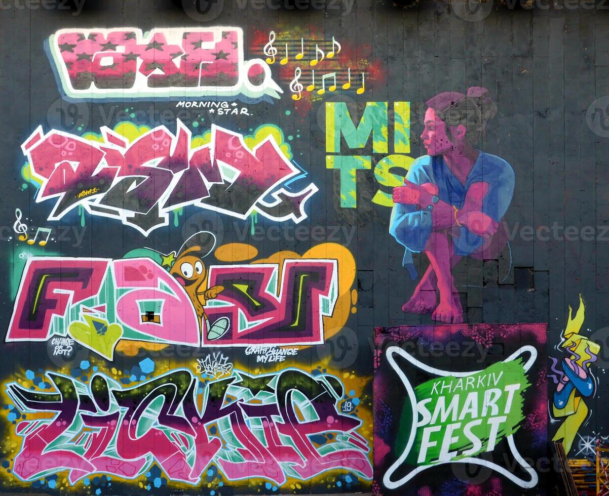Colorful background of graffiti painting artwork with bright aerosol outlines on wall. Old school street art piece made with aerosol spray paint cans. Contemporary youth culture photo