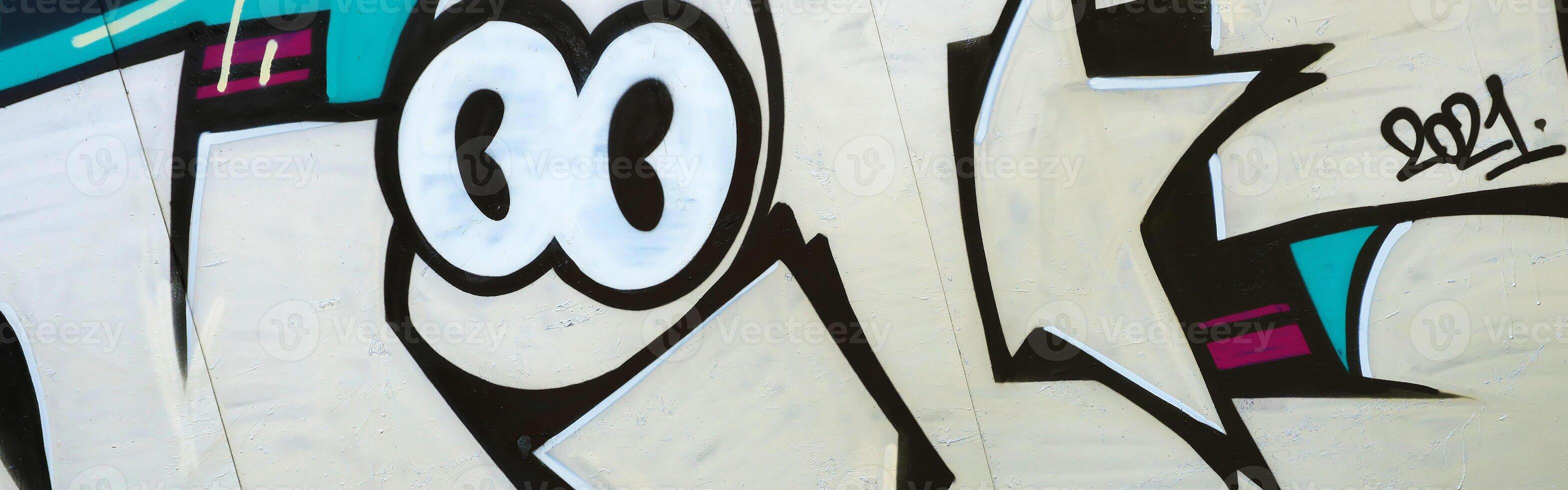 Colorful background of graffiti painting artwork with bright aerosol outlines on wall. Old school street art piece made with aerosol spray paint cans. Contemporary youth culture photo
