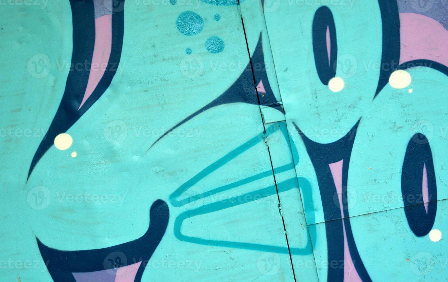 Colorful background of graffiti painting artwork with bright aerosol outlines on wall. Old school street art piece made with aerosol spray paint cans. Contemporary youth culture photo
