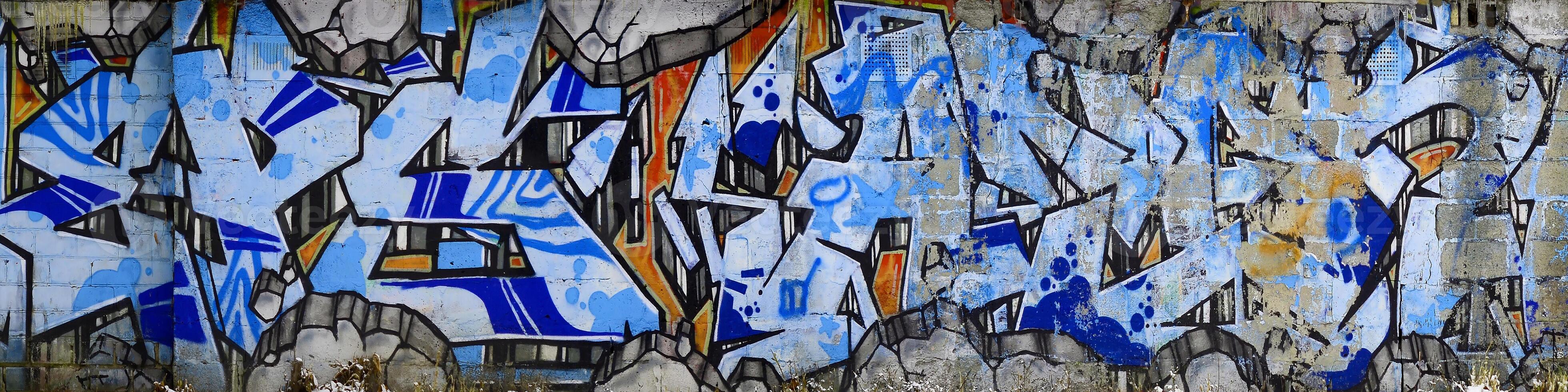 Colorful background of graffiti painting artwork with bright aerosol outlines on wall. Old school street art piece made with aerosol spray paint cans. Contemporary youth culture photo
