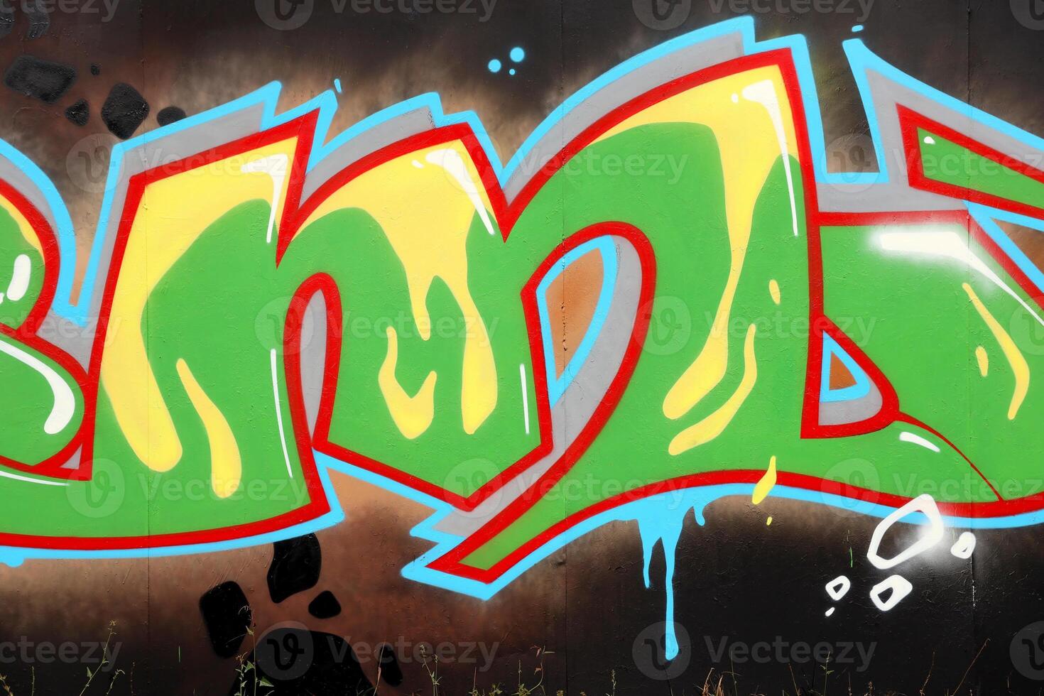 Colorful background of graffiti painting artwork with bright aerosol outlines on wall. Old school street art piece made with aerosol spray paint cans. Contemporary youth culture photo