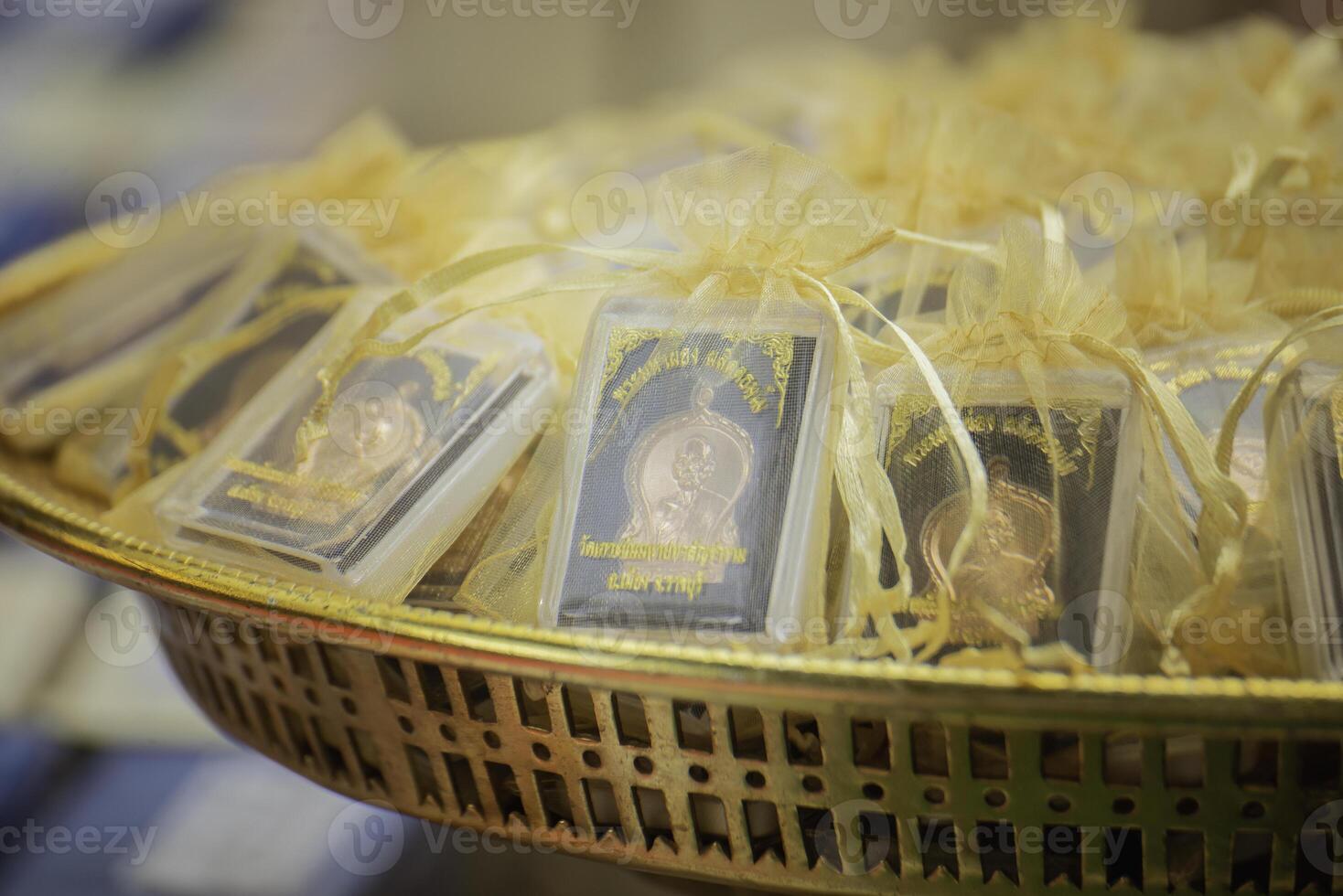 Amulets are small things that Buddhists like to worship. photo