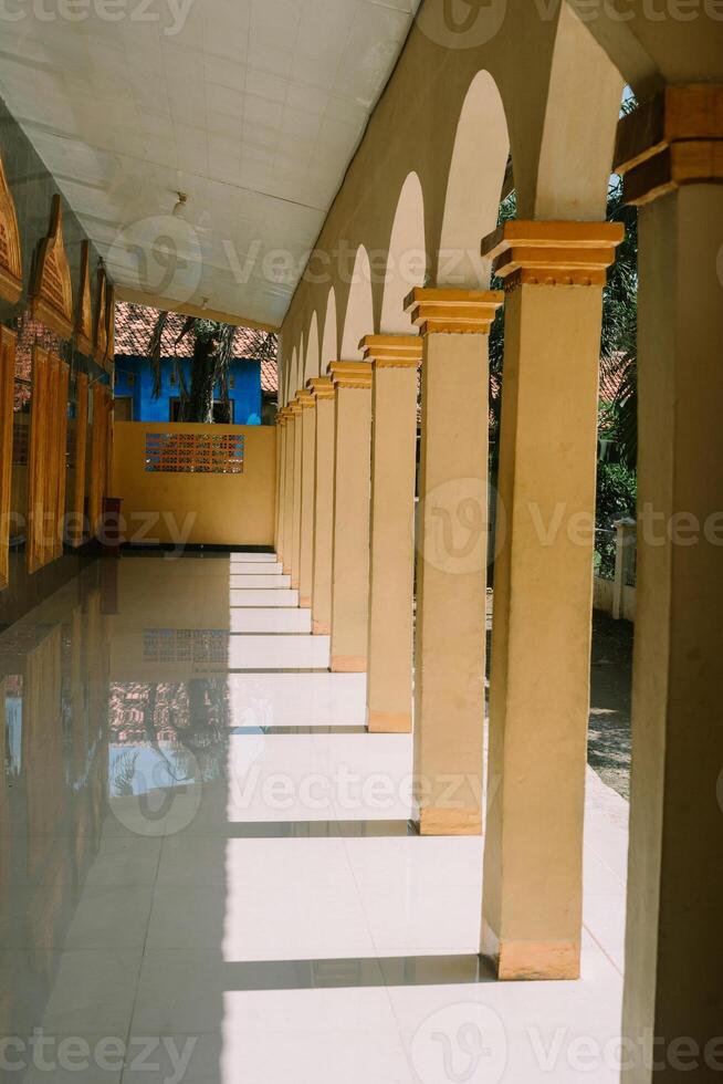 Mosque terrace with symmetrical pillars, showcasing elegant architecture and a serene ambiance photo