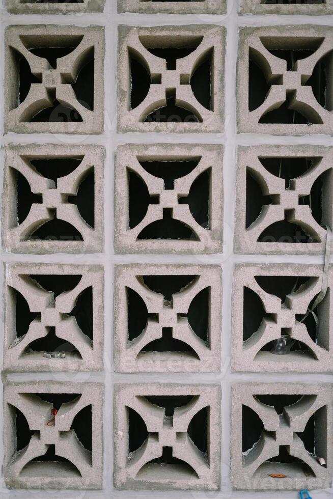 Ventilation grille installed in a wall, highlighting the structure's airflow and cooling system photo