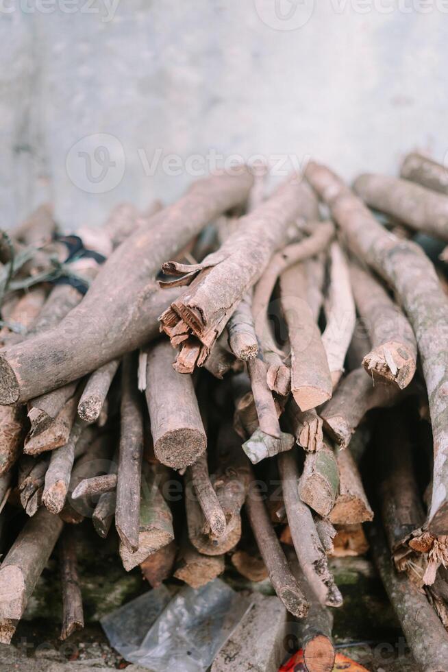 Piled firewood, featuring neatly arranged logs, perfect for heating or outdoor campfires. photo