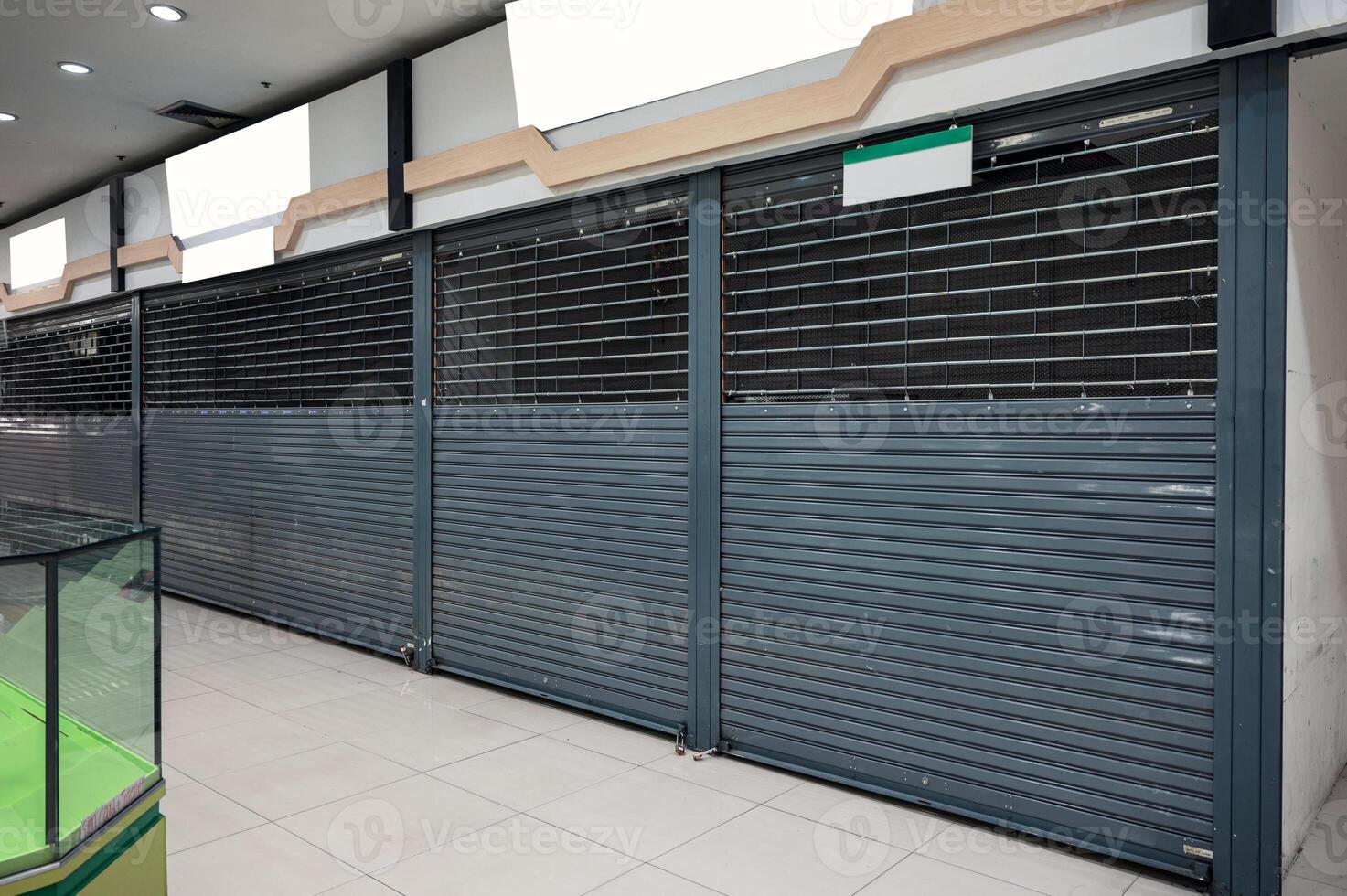 Abandoned closed shutter shop in department store photo
