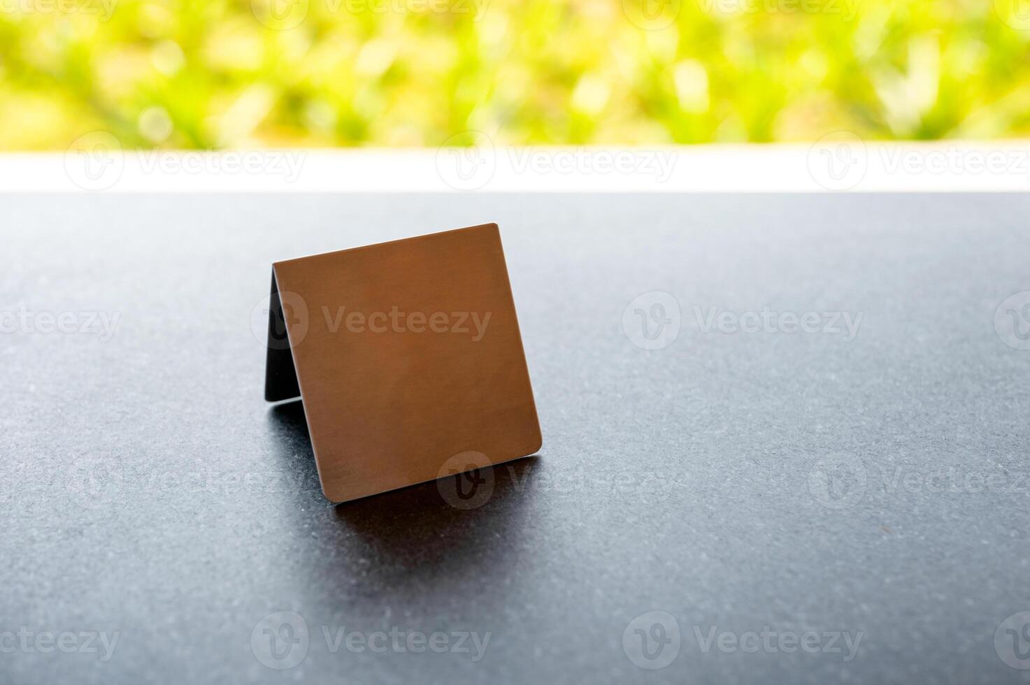 Mock up stainless menu frame, empty table tent stand on the table photo
