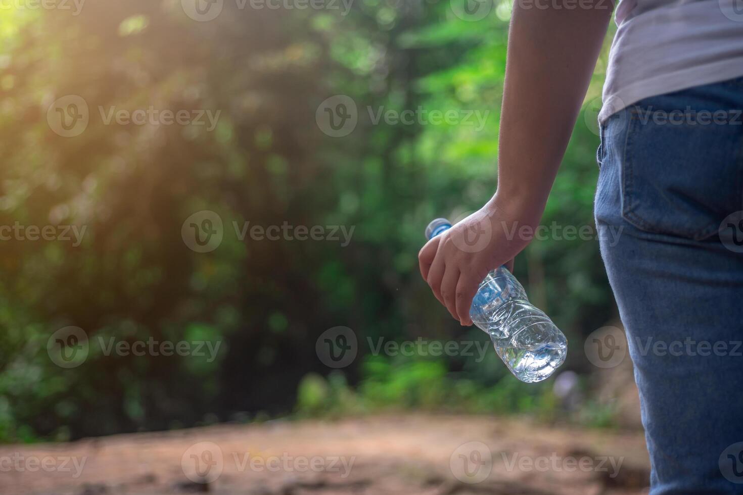 Conservation of natural tourist attractions, Sustainable tourism, Tourists are collecting plastic waste from natural attractions to put in trash cans photo