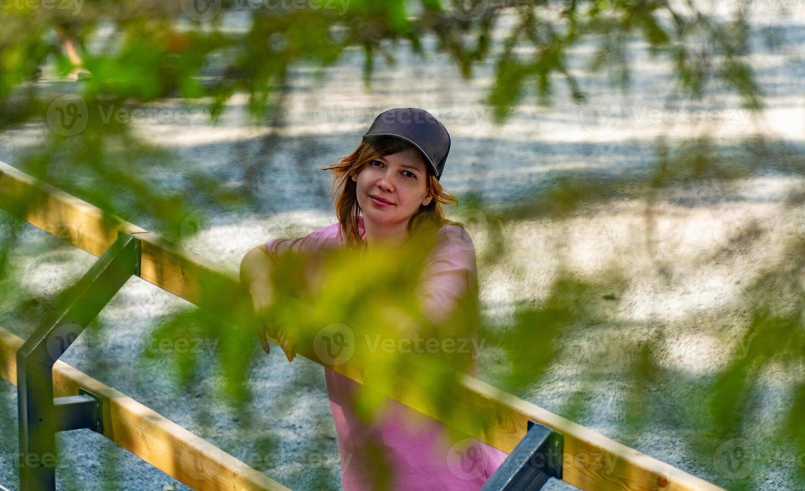 Young Woman in Nature Captivating Portrait Through Leaves photo