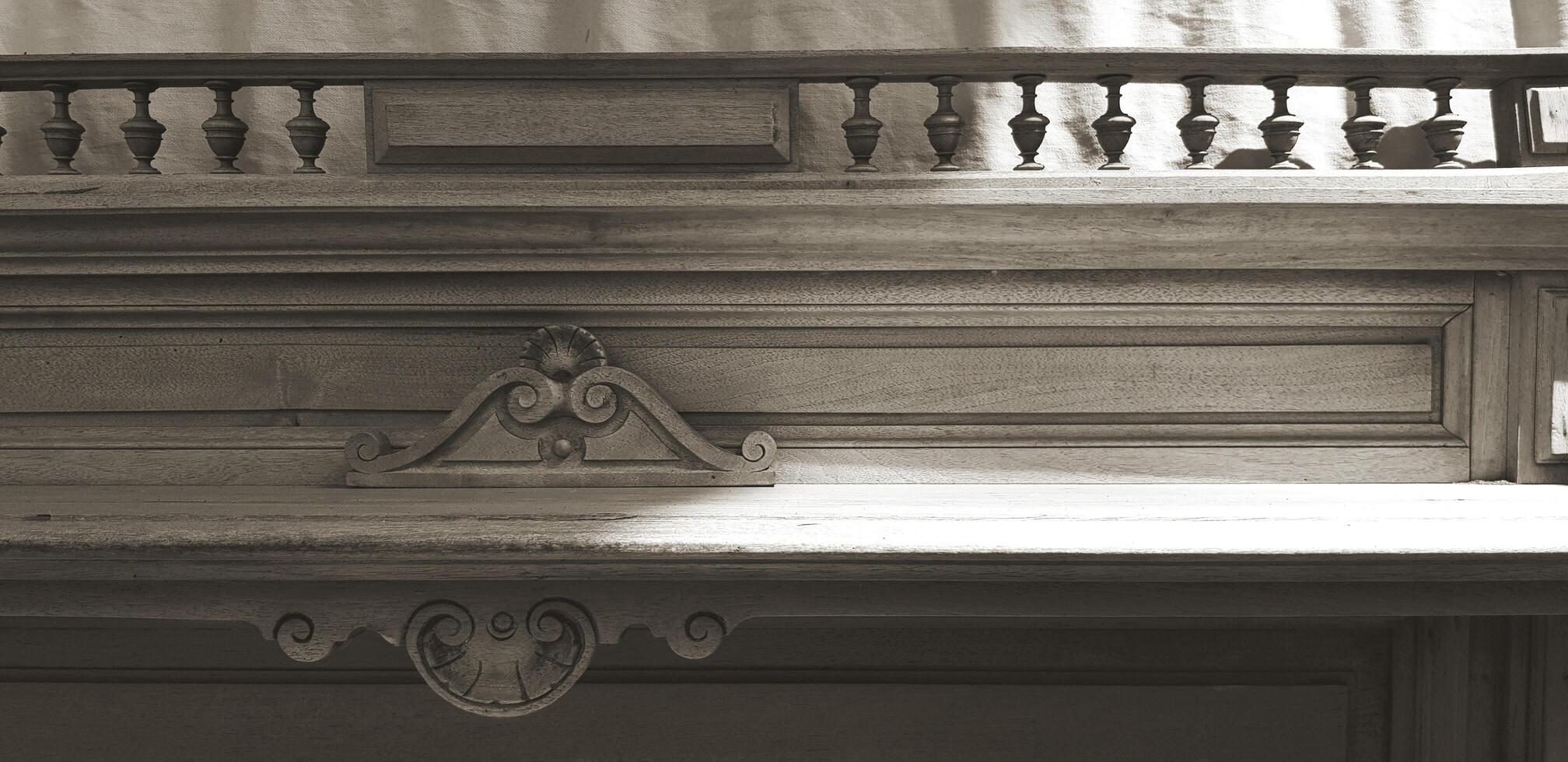 Vintage wooden shelf for putting stuff with sunlight from beside in black and white style. Decoration, Classic object and Beautiful design in monochrome concept. photo