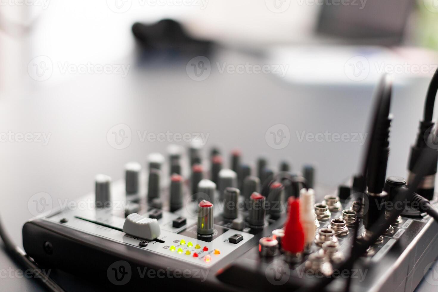 Closeup of station for recording and speaking during online podcast. Influencer making social media content with production microphone in professional home studio with modern equipment photo