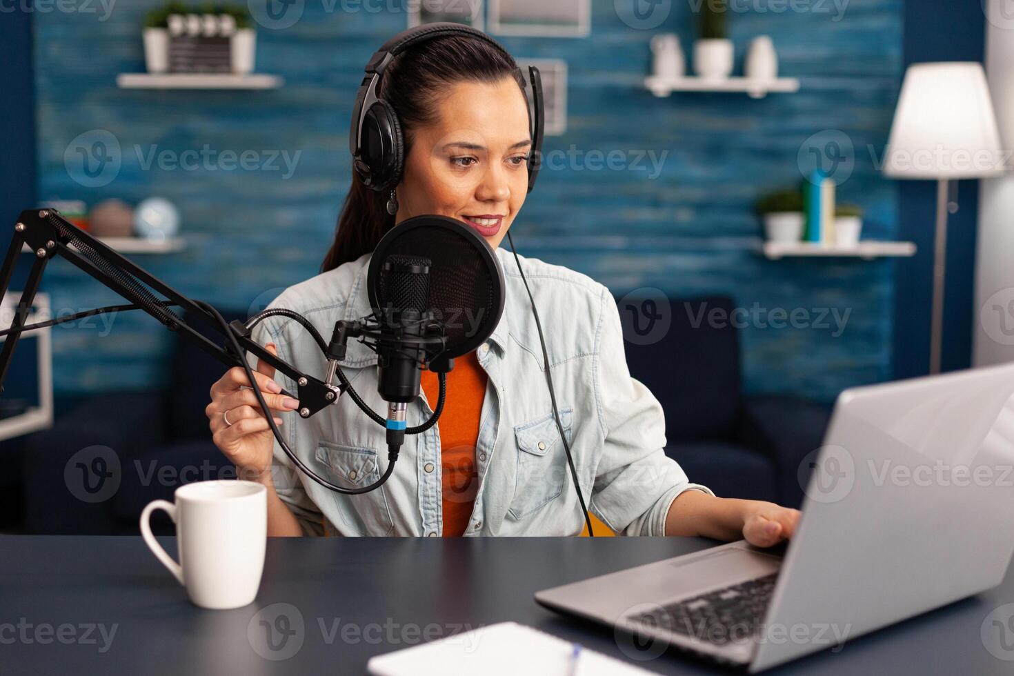 Stylish woman recording vlog and sharing content on streaming platform using social network. Influcencer woman in digital marketing making brodcast for offering lifestyle advice. photo