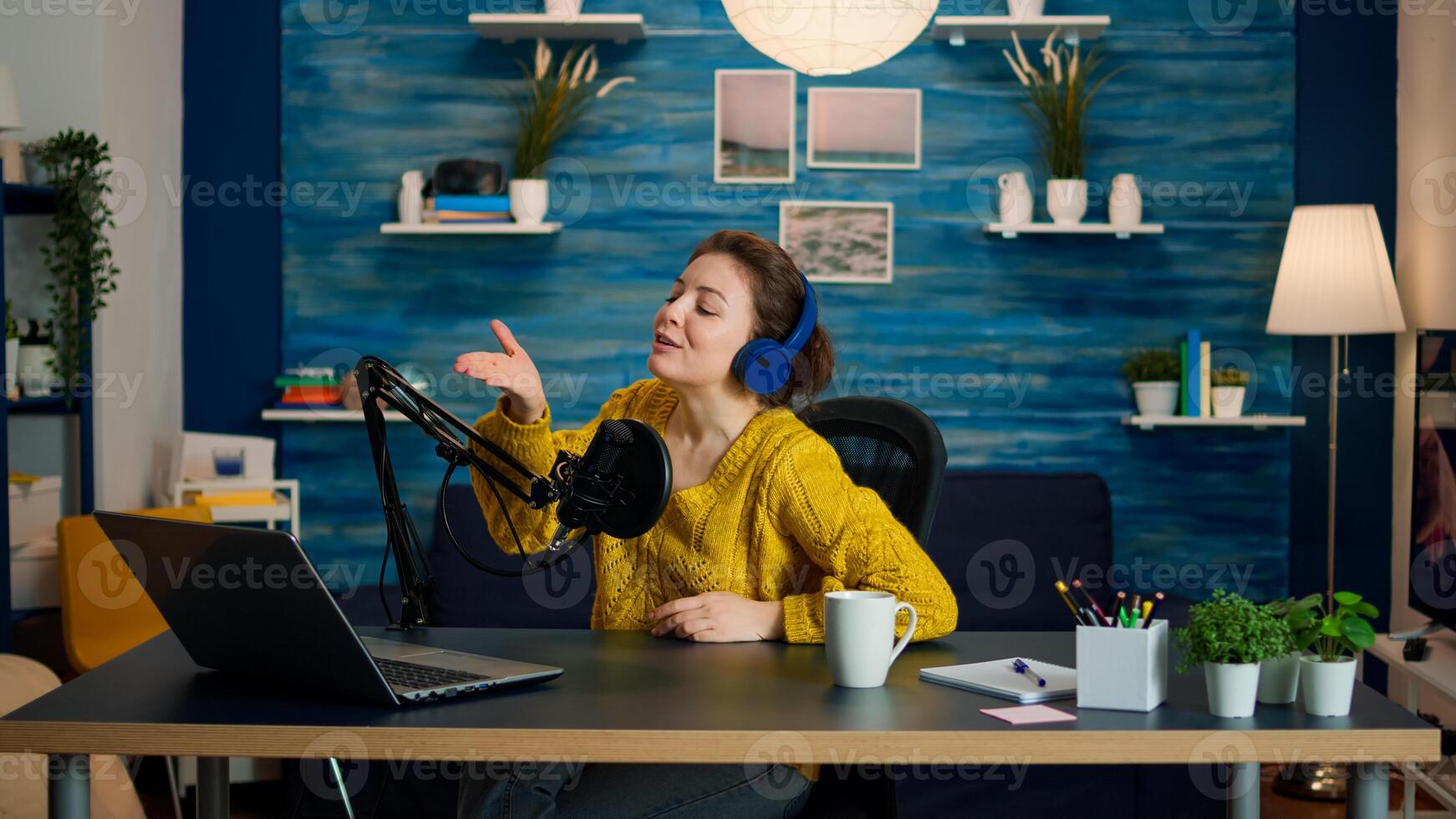 Famous vlogger kissing followers at camera from home studio durinng podcast. On-air online production internet broadcast show host streaming live content, recording digital social media communication photo