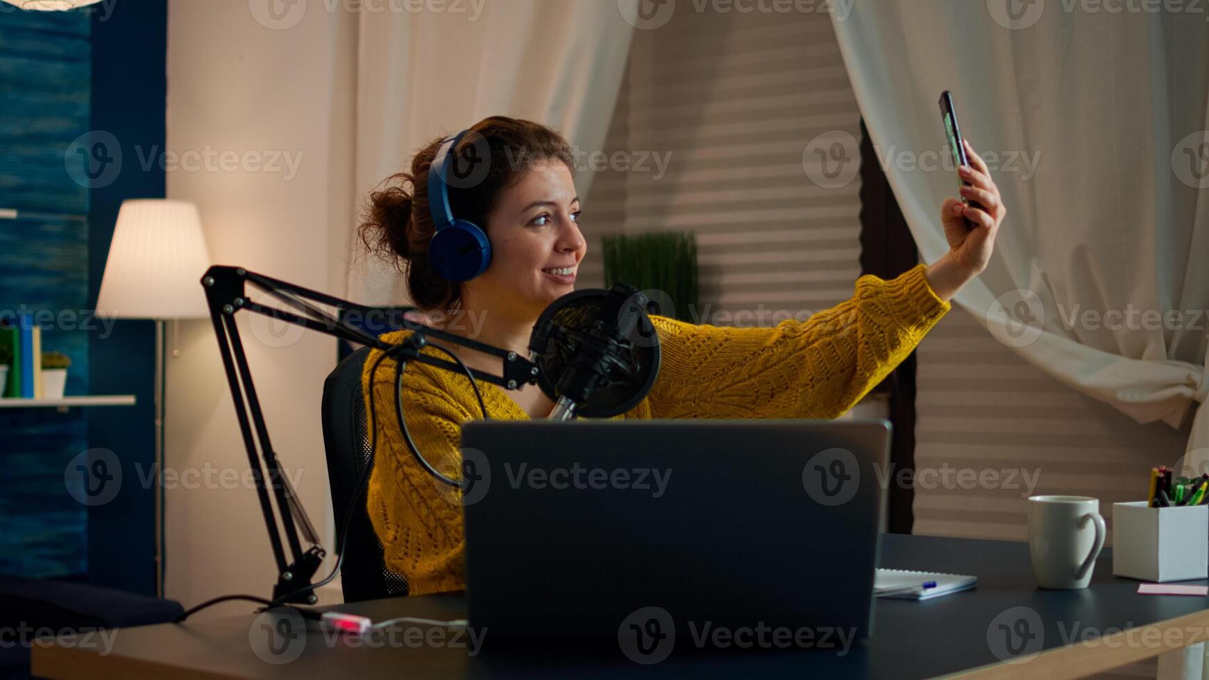 Entertainment blogger doing selfie during broadcast working from home studio. On-air online production internet podcast show host streaming live content, recording digital social media communication photo