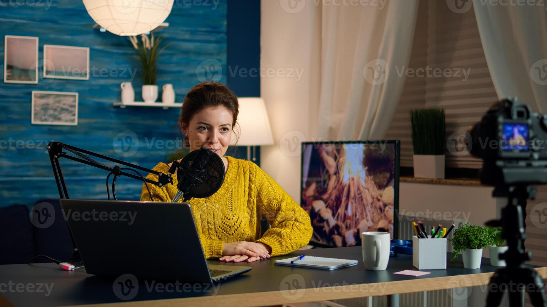 Social media star talking at camera and recording a new episode of show. Content creator influencer speaking during livestreaming for internet web online subscribers audience in live podcast photo