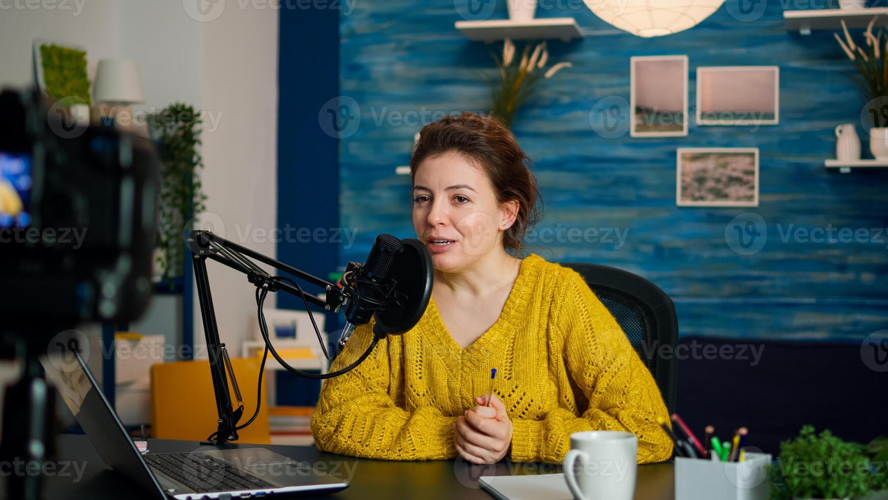 Influencer doing vlog production with professional gear in home studio. Online show On-air production internet broadcast host streaming live content, recording digital social media communication photo
