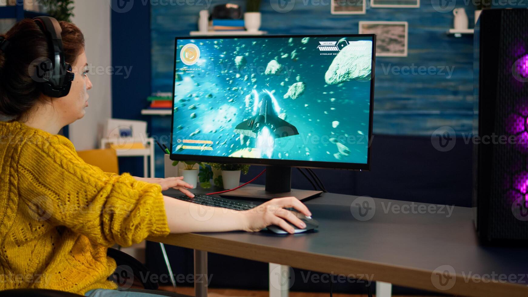 Professional esport woman gamer compete in a game playing on a championship event. Online streaming cyber performing on powerful personal computer in stylish room during gaming tournament photo