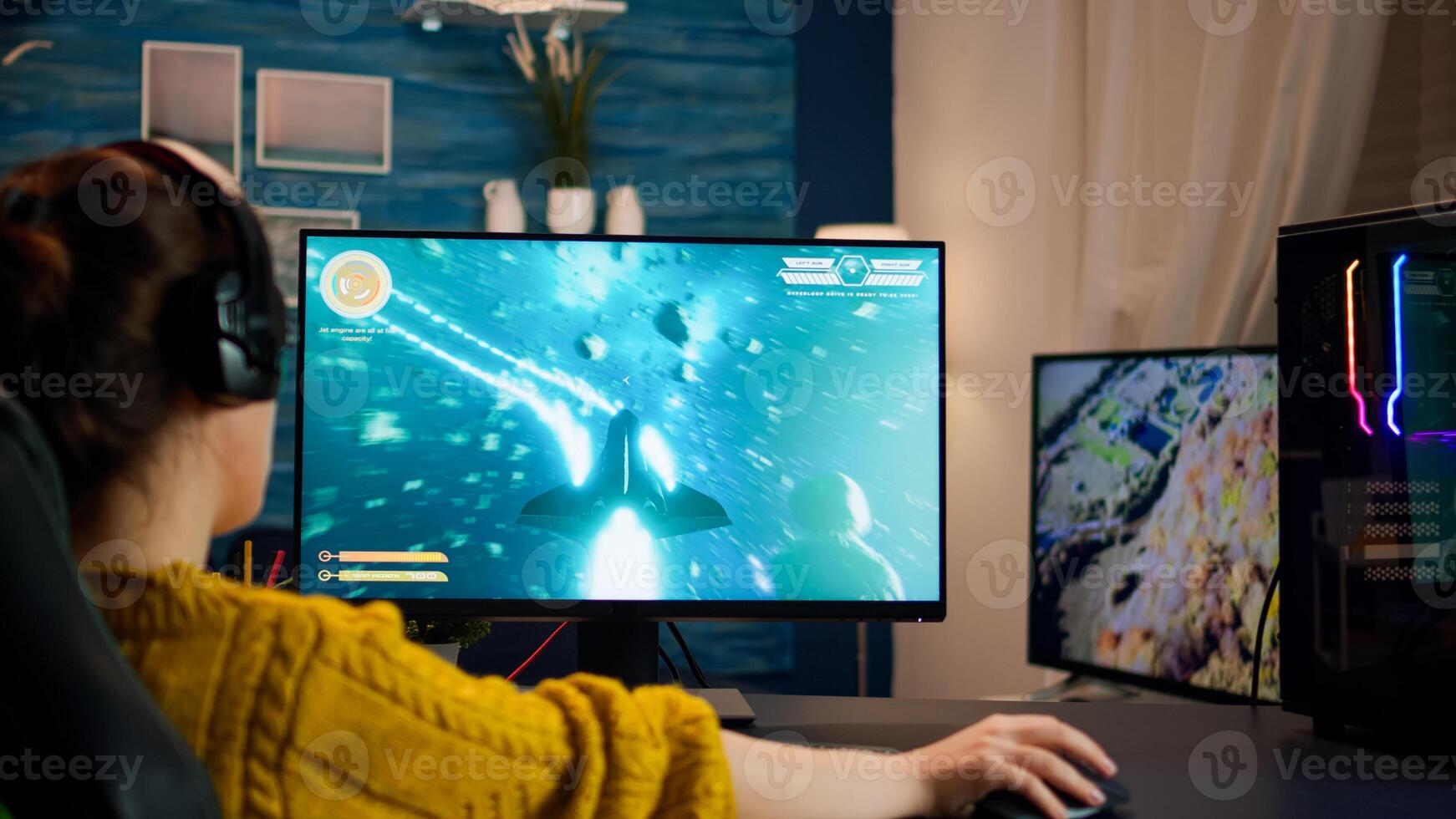 Pro cyber sport gamer playing game with RGB keyboard and mouse. Virtual shooter game championship in cyberspace, esports player performing on computer in stylish room during gaming tournament photo