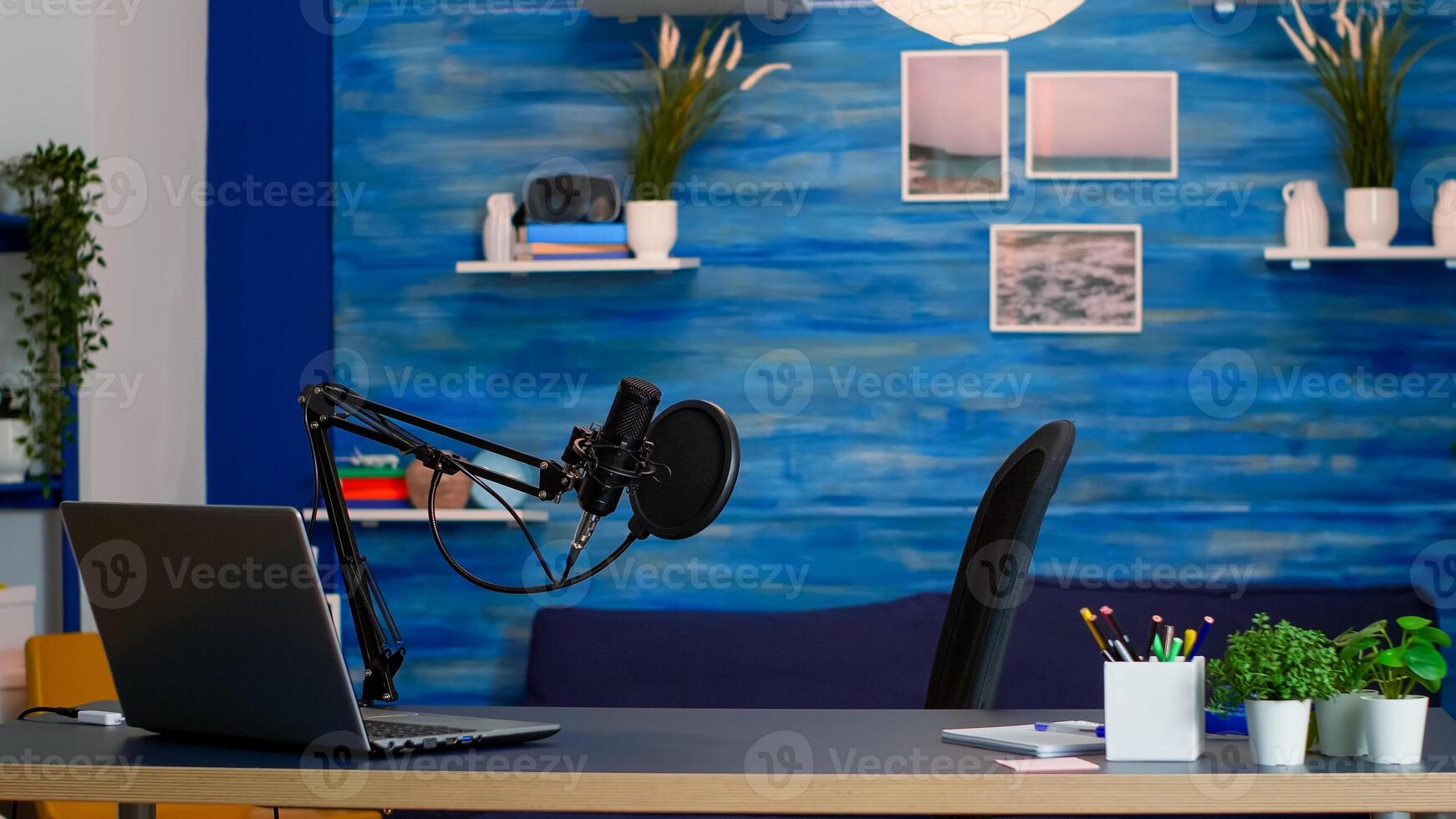 Empty professional setup for recording podcast in home studio of vlogger. Influencer recording social media content with production microphone, digital web internet streaming station photo