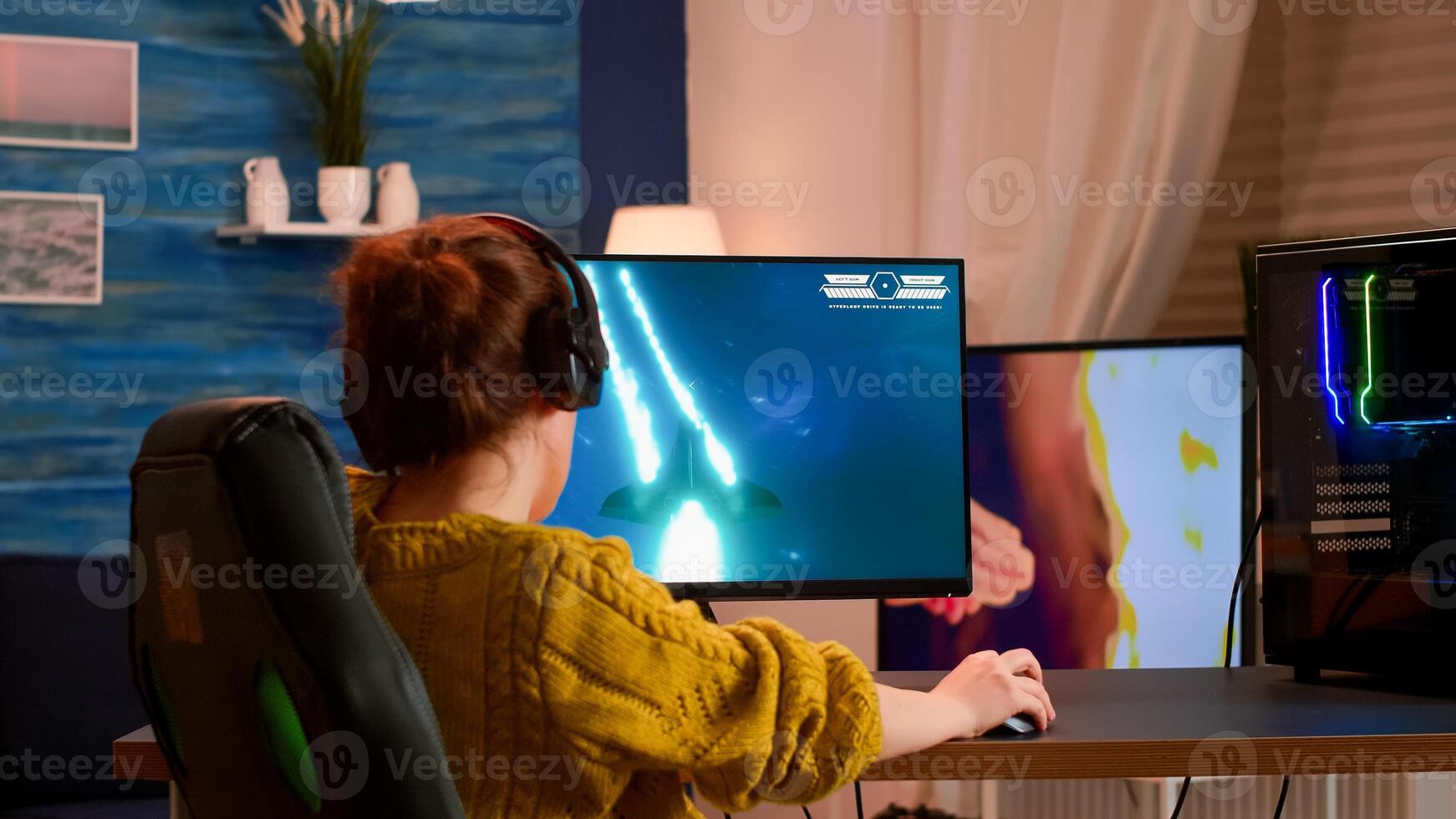 Virtual shooter game in cyberspace, esports player performing on pc gaming tournament. Online streaming cyber playig on powerful personal computer during virtual championship photo