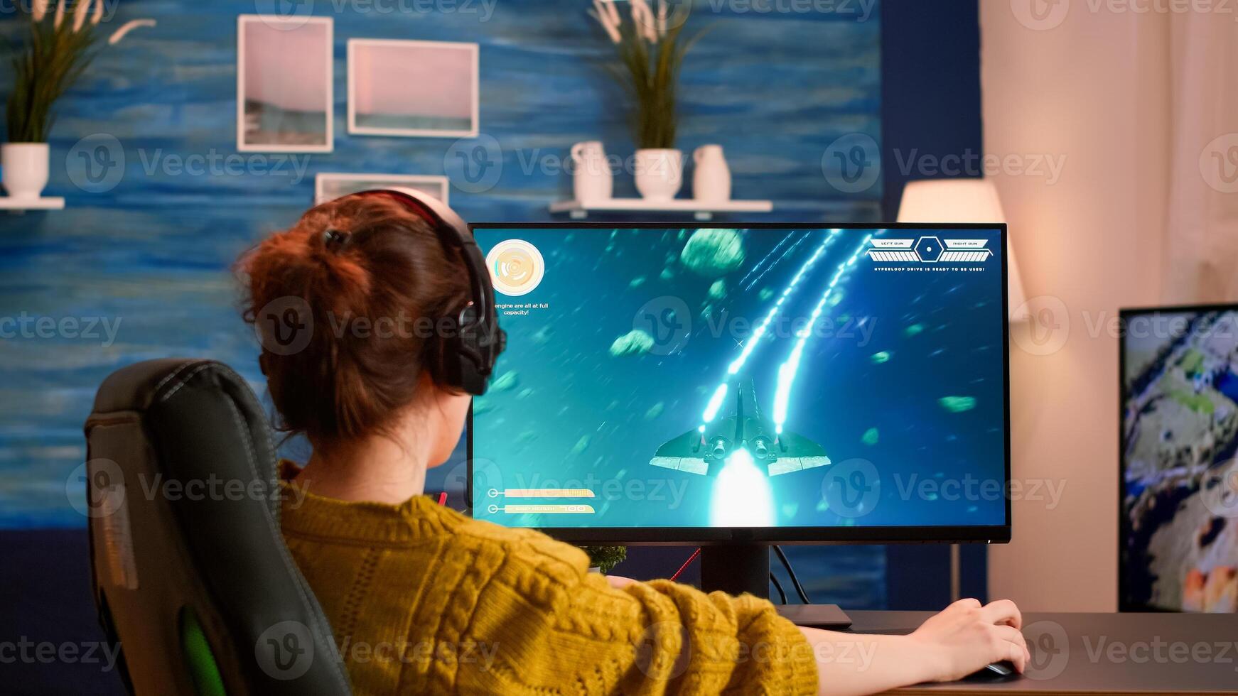 Pro gamer putting on headset testing new space shooter game playing from home at professional computer. Virtual shooter game in cyberspace, esports player performing on pc gaming tournament photo
