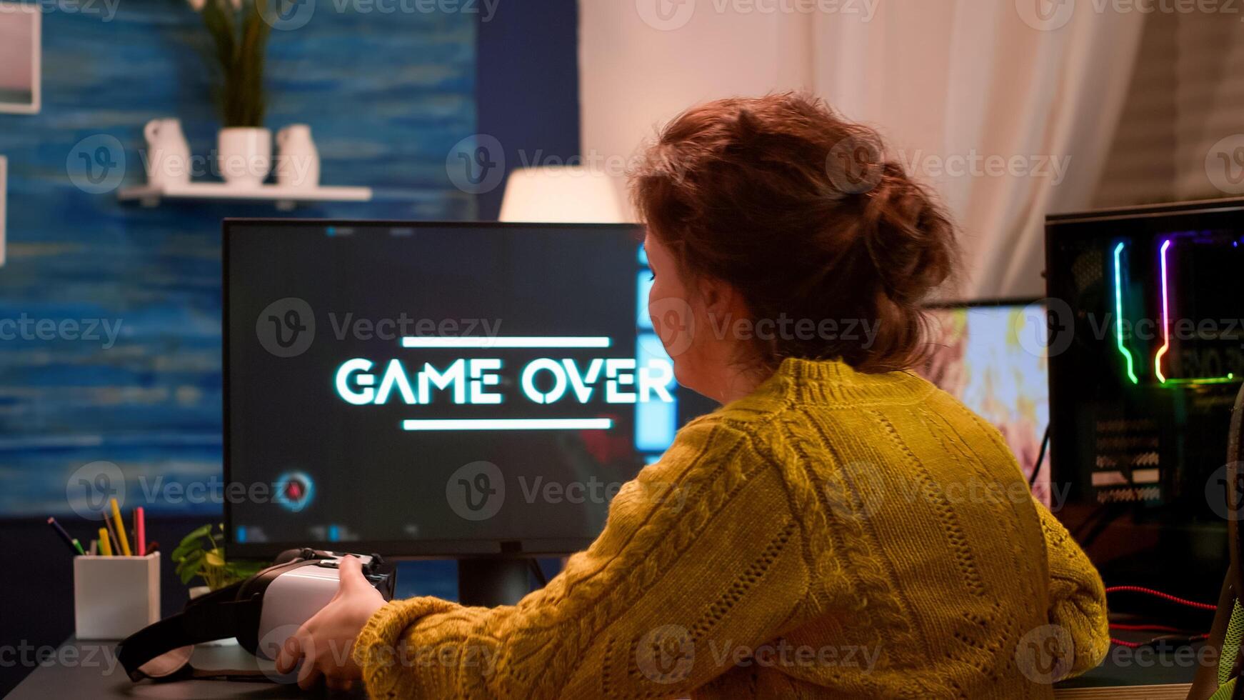 Professional player wearing virtual reality headset holding wireless controller performing shooter game. Virtual shooter game championship in cyberspace, esport player playing during gaming tournament photo
