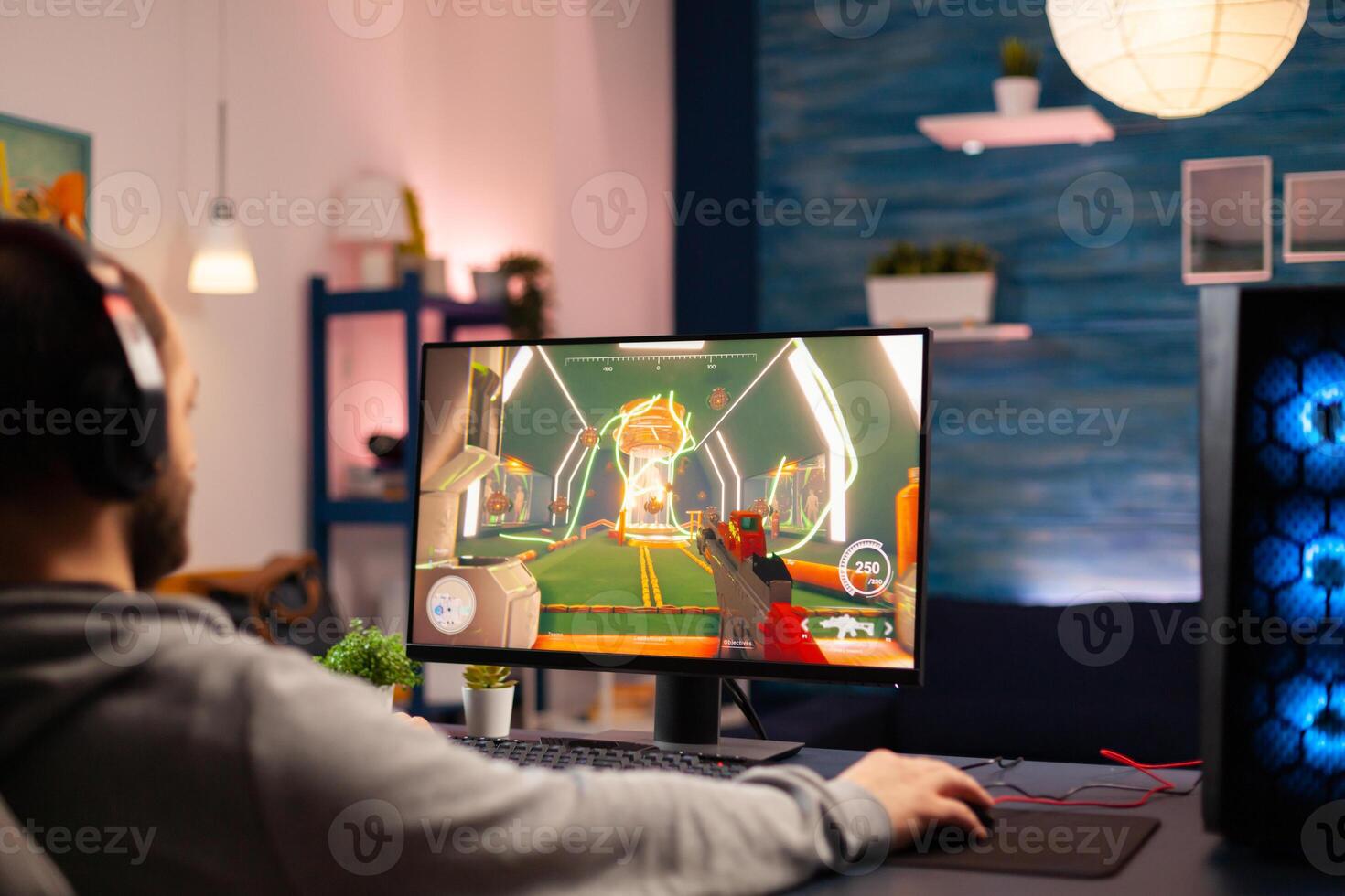Pro virtual gamer wearing headphones playing games at professional computer late night. Online streaming cyber performing during gaming tournament using technology network wireless photo