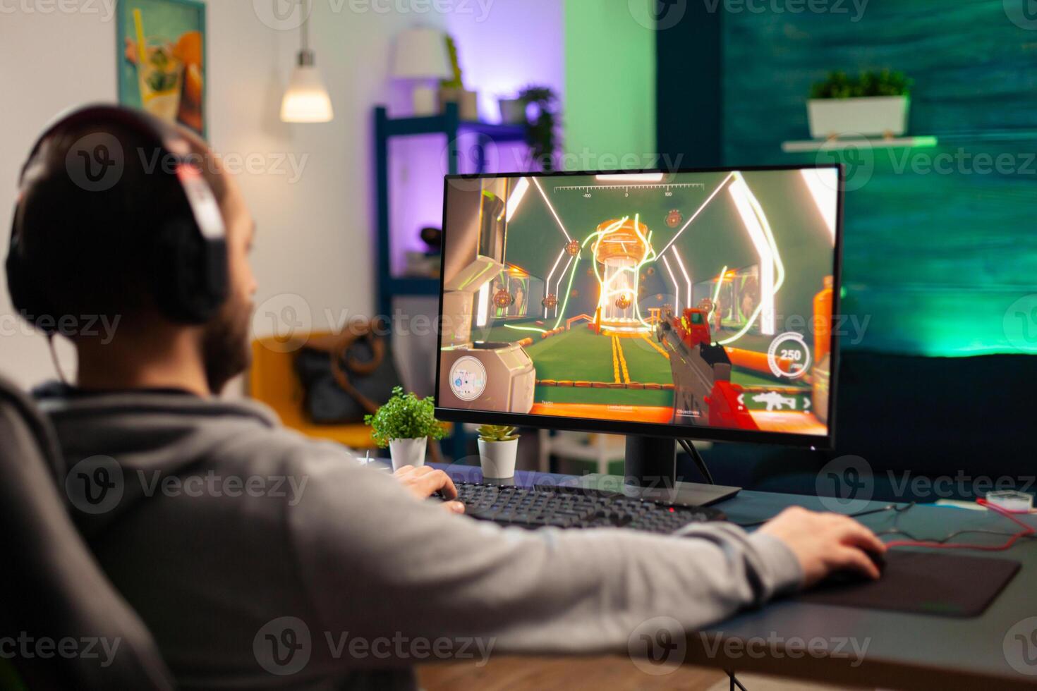 Pro player playing on computer videogame for tournament using professional headphones. Online streaming cyber performing during gaming competition using technology network wireless photo