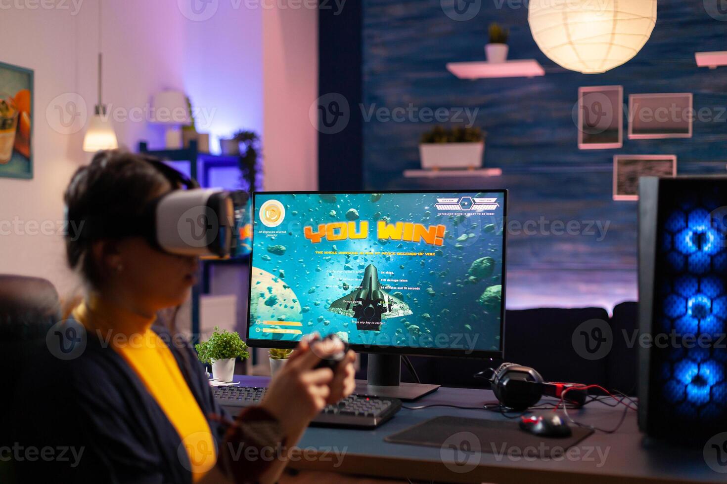 Woman gamer winning videogames with vr headset on powerful computer with professional joystick. Virtual online streaming cyber performing during game tournament using modern equipment. photo