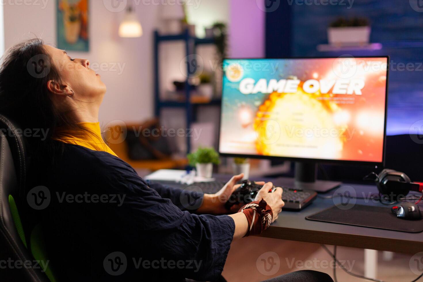Player woman winning space shooter game using virtual reality goggles playing games with modern joystick. Professional gamer streaming online videogames with new graphics on powerful computer photo
