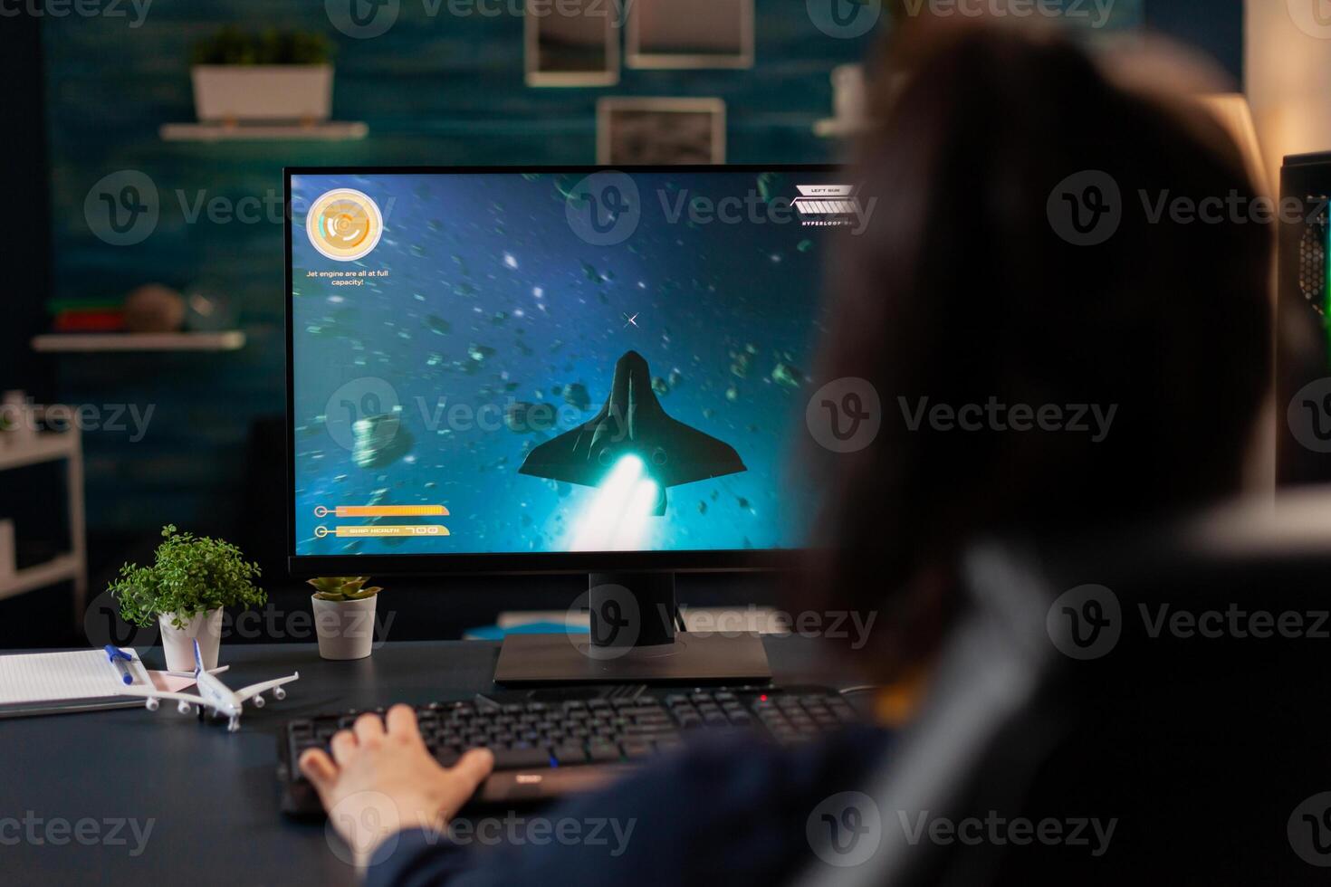 Digital gamer playing esport games for virtual tourtament use professional gaming equipment. Pro player streaming on powerful computer online game new graphics using RGB keyword photo