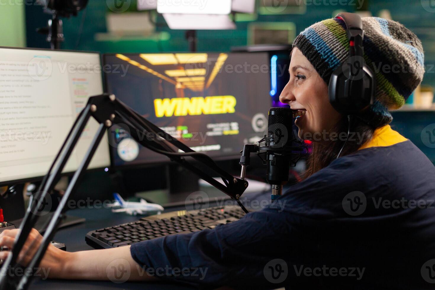 Videogame streamer losing videogame competition while wearing professional headset. Defeated gamer using modern controller for online tournament late at night in gaming room photo