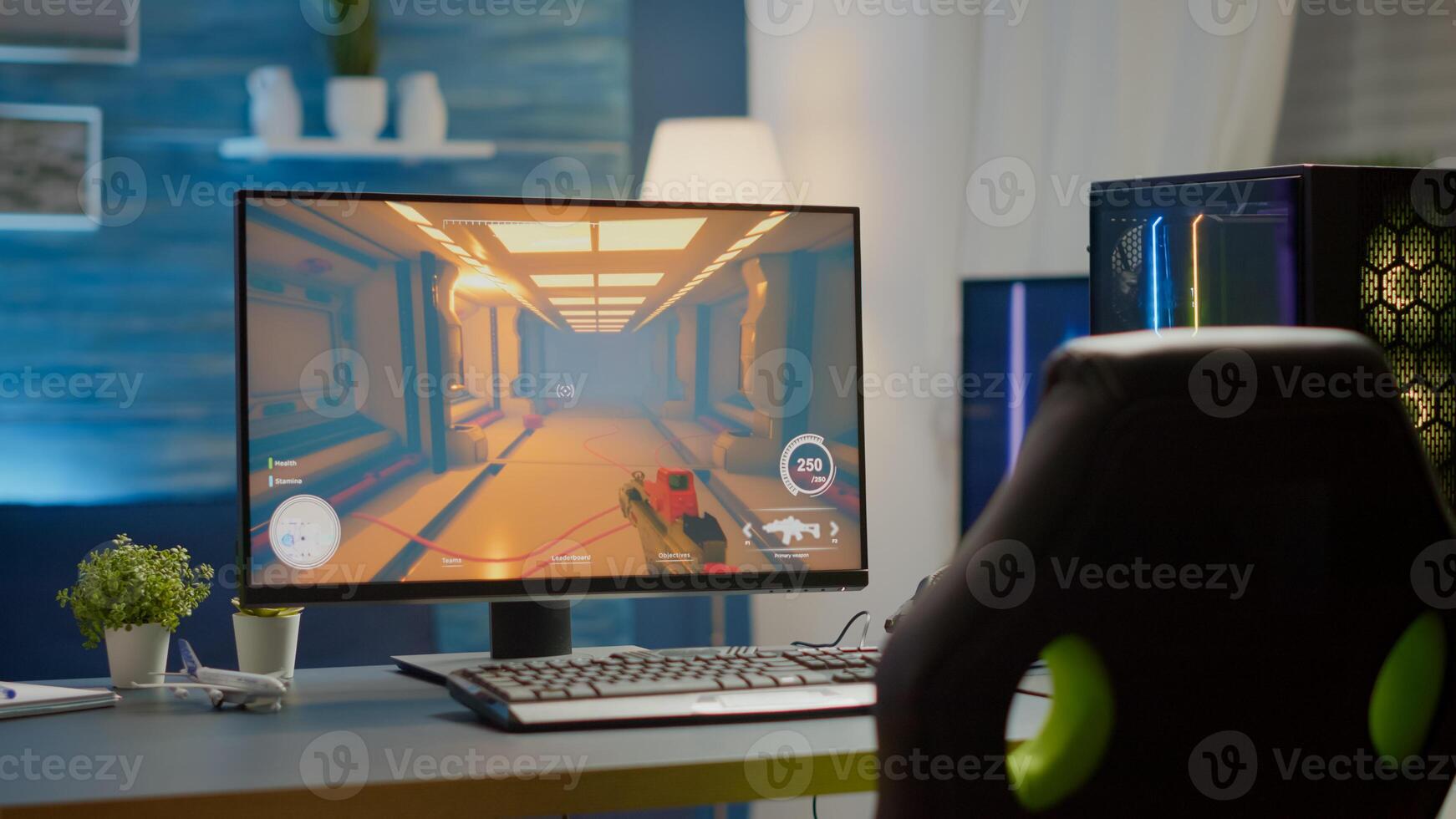 Empty cyberspace with RGB powerful personal computer with first-person shooter game on screen in gaming studio with no people at desk prepared for online esports tournament. Room with no people photo