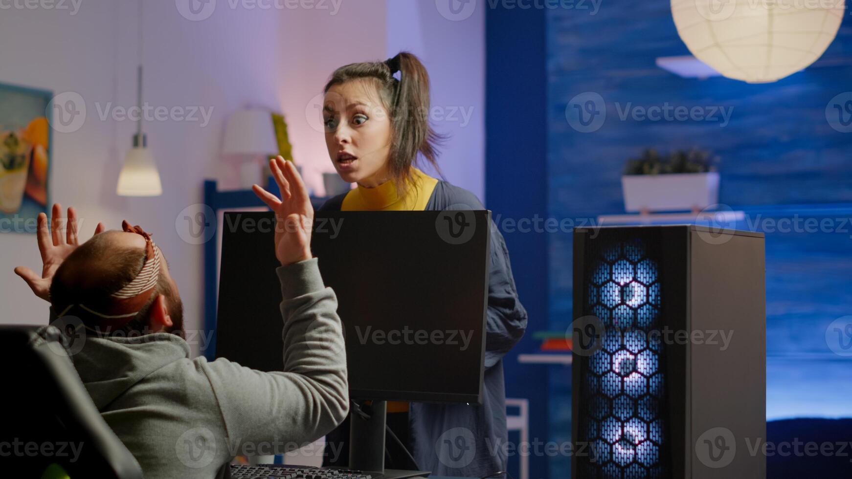 Wife arguing with man gamer during space shooter videogame tournament playing on RGB powerful personal computer. Pro cyber player performing games streaming from home at online championship photo