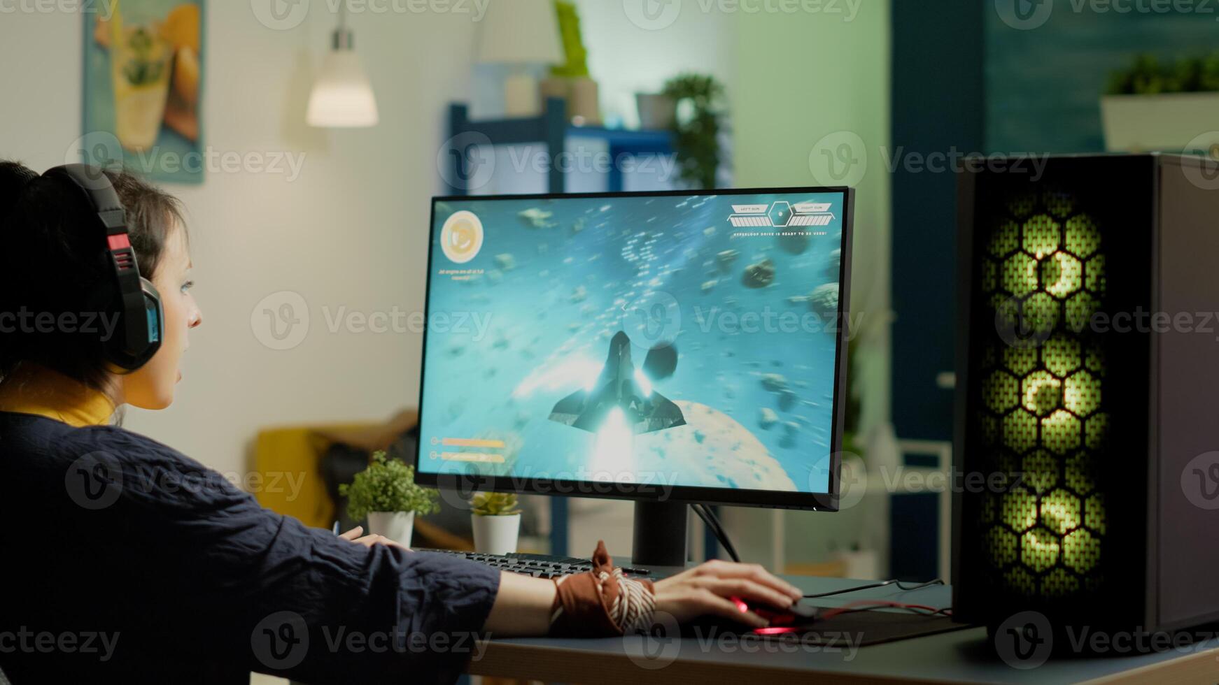 Pro gamer streaming online game with new graphics from gaming room using RGB powerful computer playing space shooter game for live tournament late at night. Professional player in esports photo